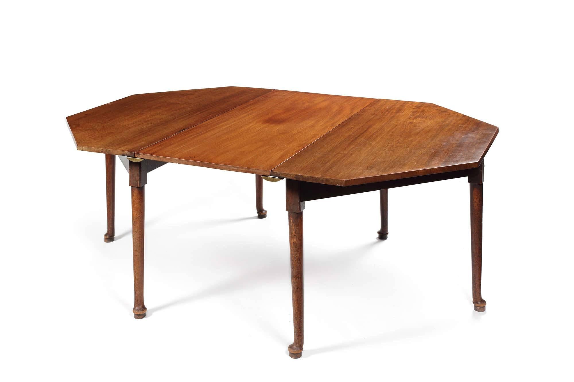 The octagonal top raised on turned tapering legs terminating in pad feet. The central leaf possibly a replacement using period timber. The table is also intended to be used as a pair of console tables when not required for dining.
? 
See S.Stuart,