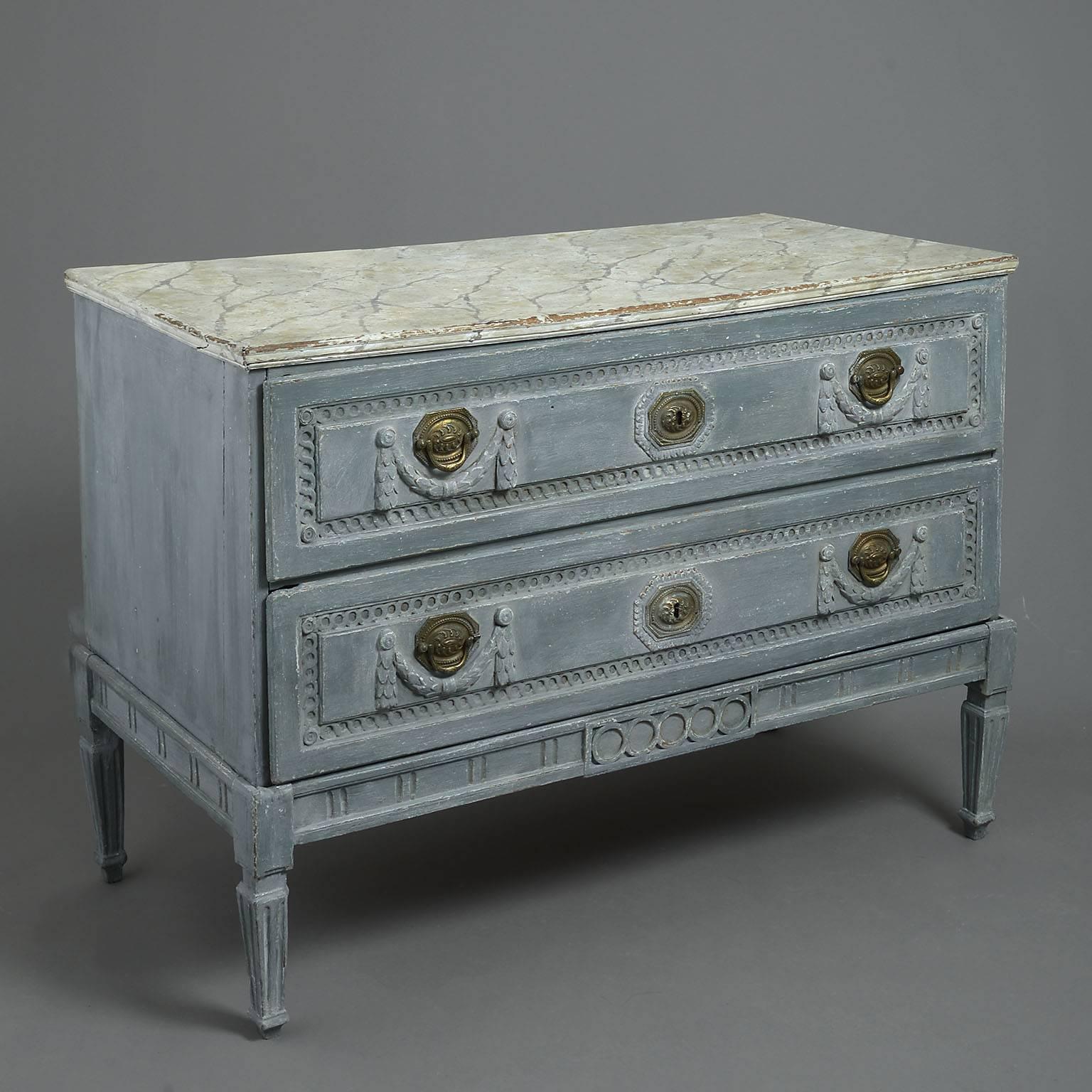 The faux marble-top over an arrangement of two long drawers carved with neoclassical decoration consisting of guilloche borders with swags below the original brass handles and raised on a separate neoclassical stand

Origin: Low countries.
 