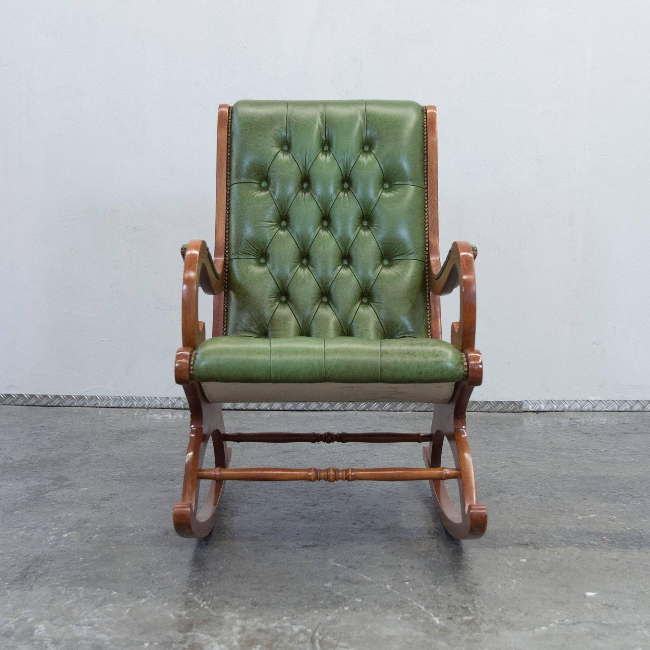 Vintage Chesterfield rocking chair in green leather.