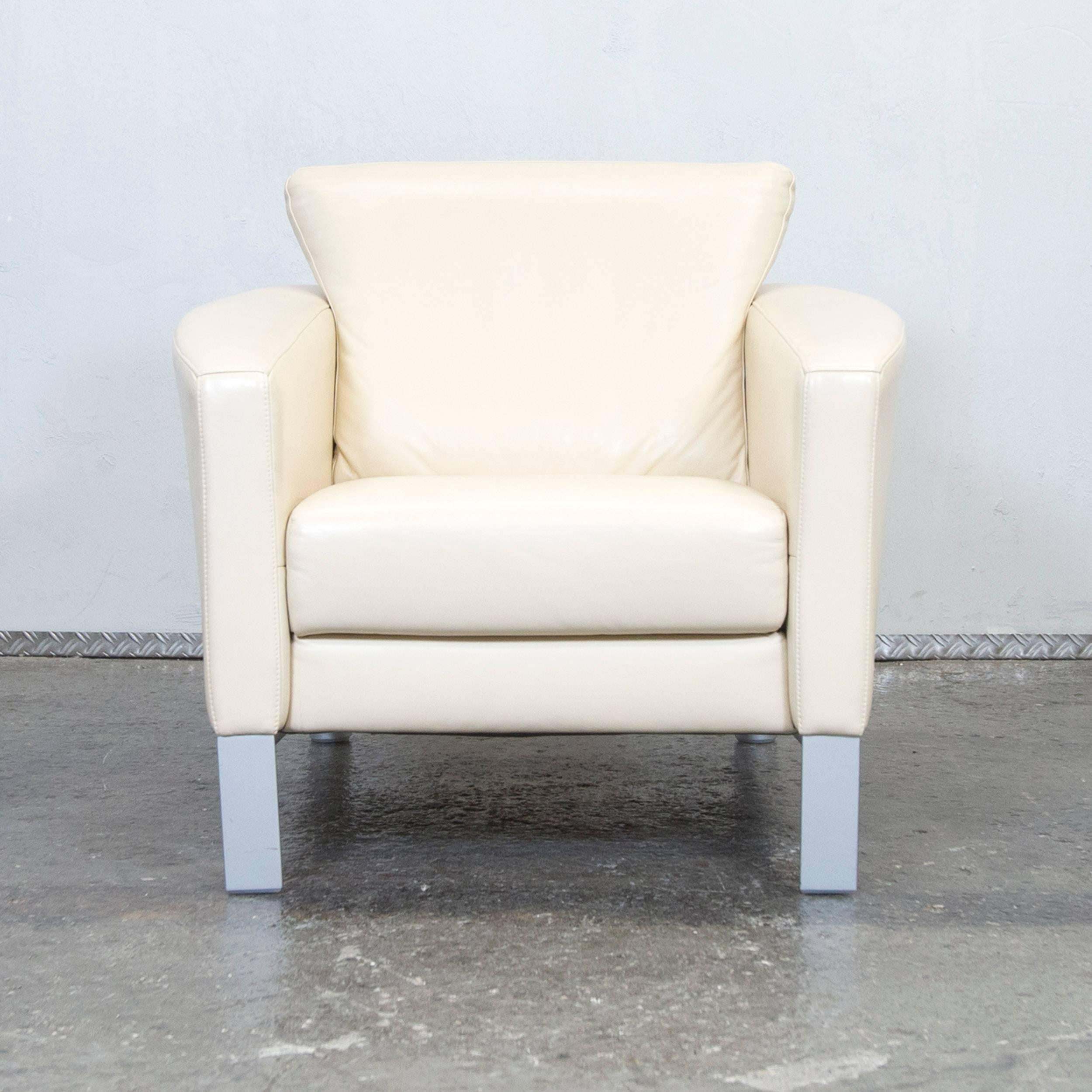 Original crème colored Rolf Benz leather armchair with a minimalistic and modern style.