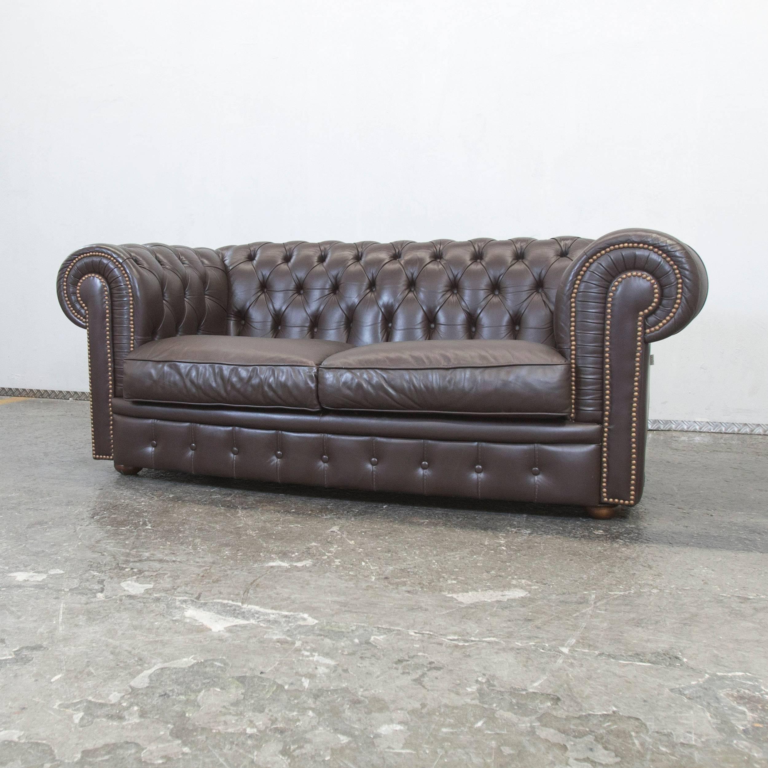 Elegant brown colored Chesterfield sofa from Calia, with a vintage style, designed for pure luxurious comfort.
