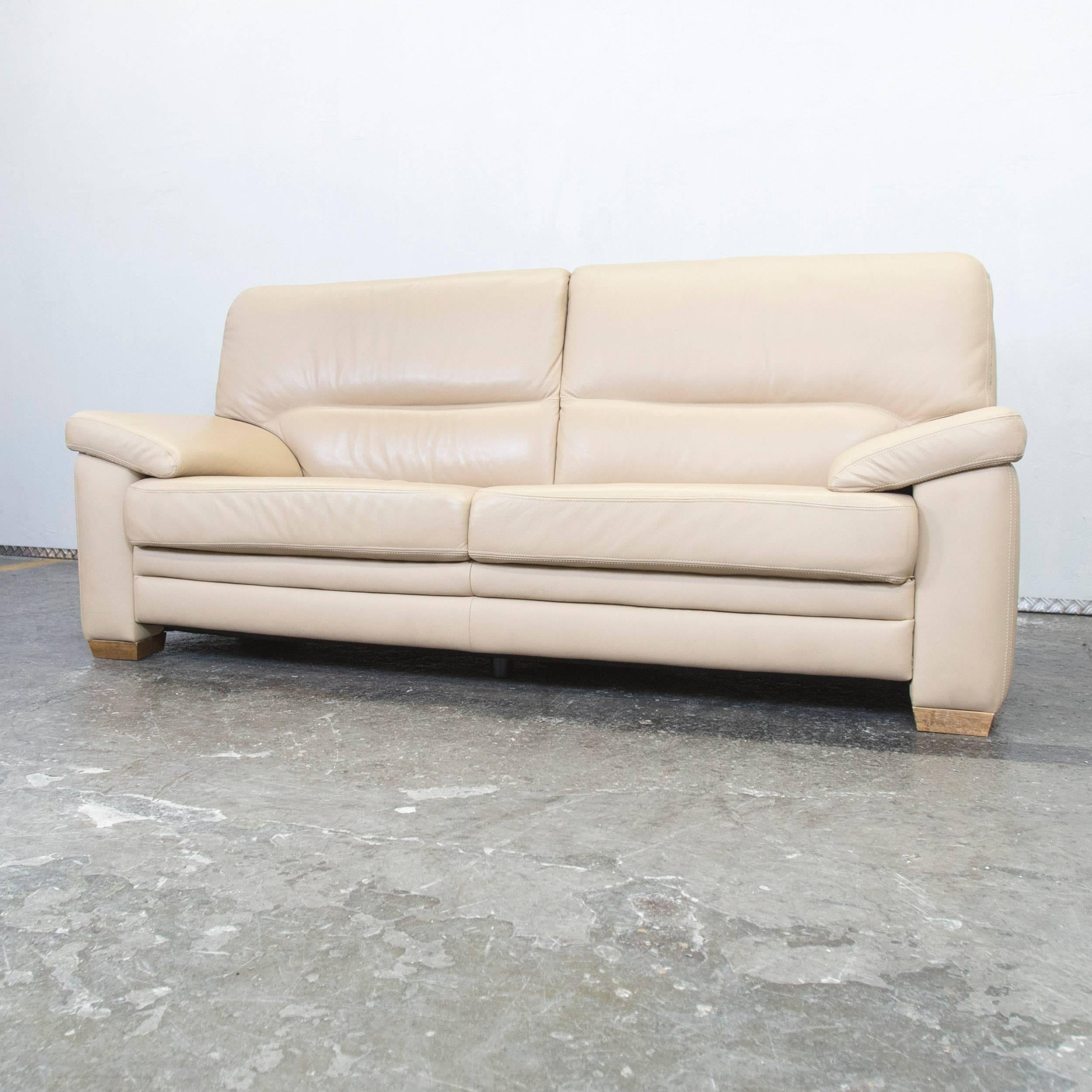 Beige colored designer sofa, with a modern design, designed for pure comfort.