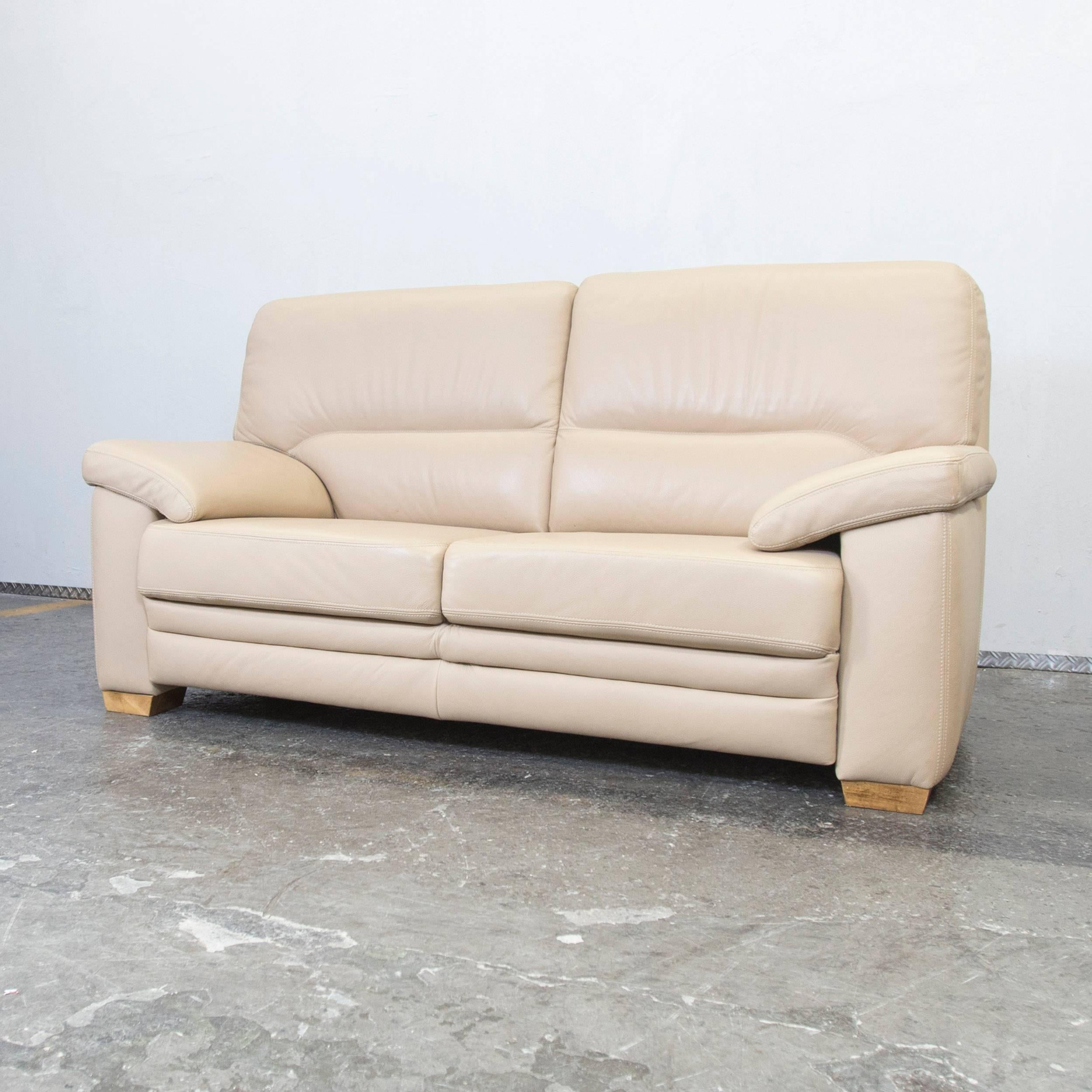 Beige colored designer sofa, with a modern design, designed for pure comfort.
