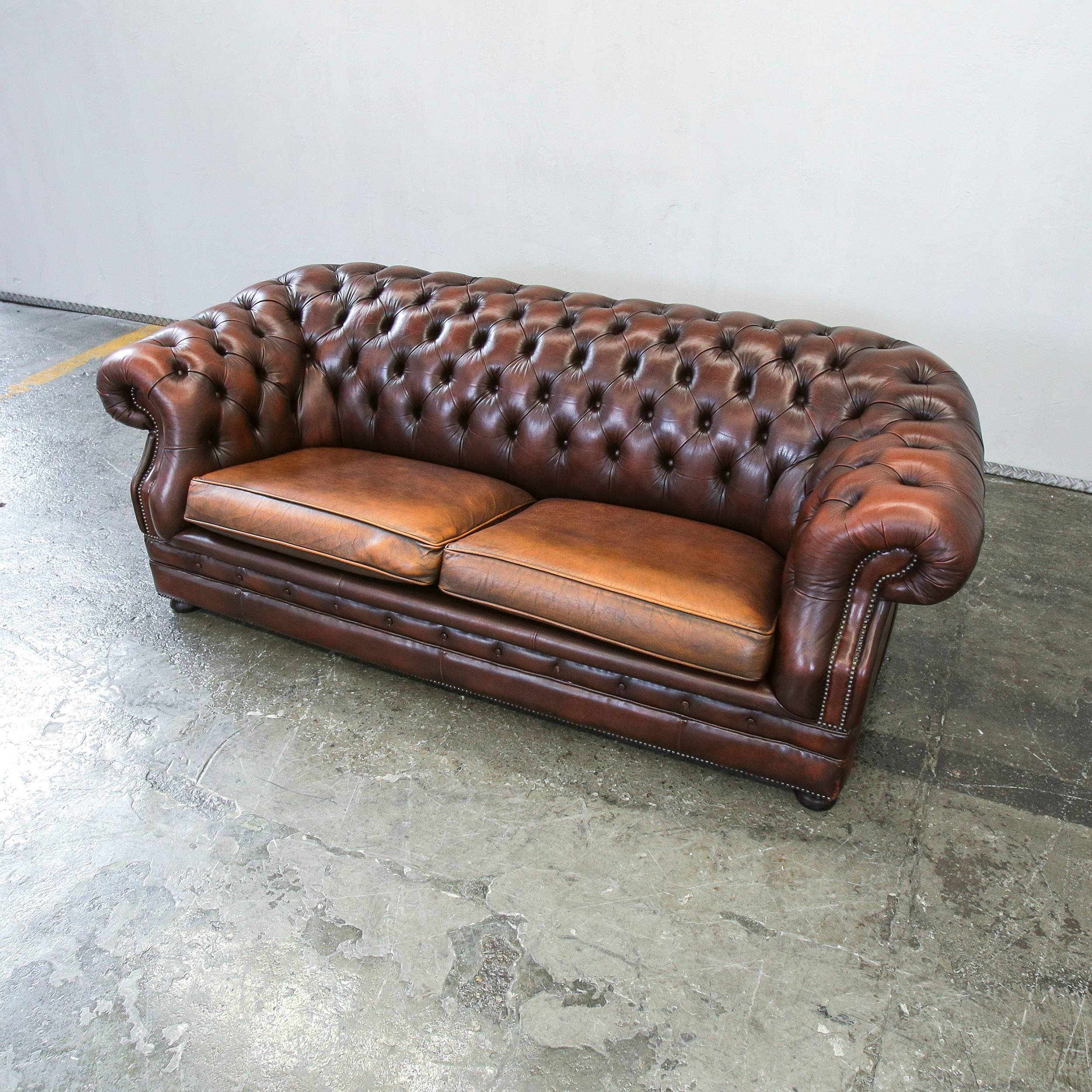 Brown colored Chesterfield leather sofa in an elegant vintage style, designed for pure comfort.