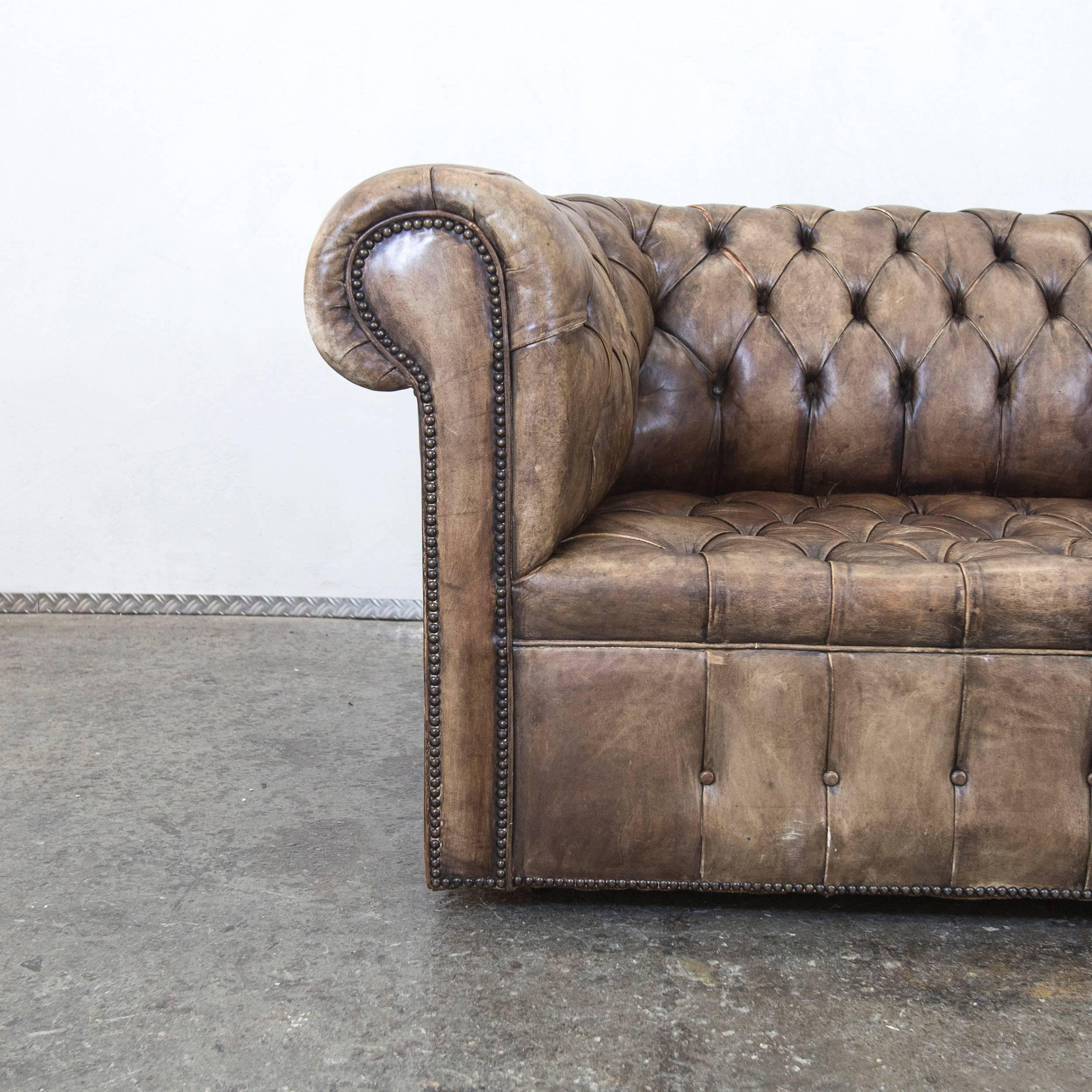 Brown beige colored Chesterfield leather sofa with an elegant vintage style, designed for pure comfort.