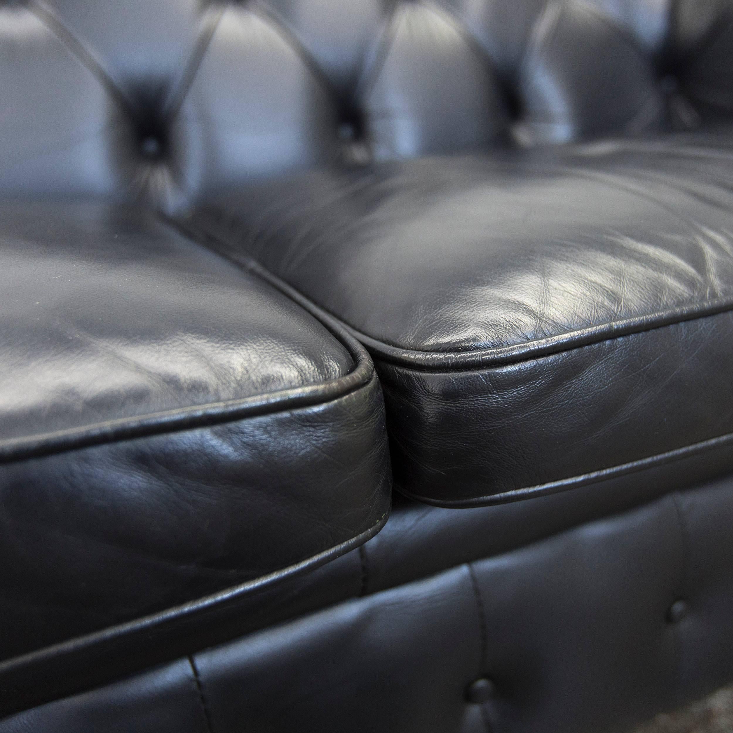 black chesterfield two seater sofa