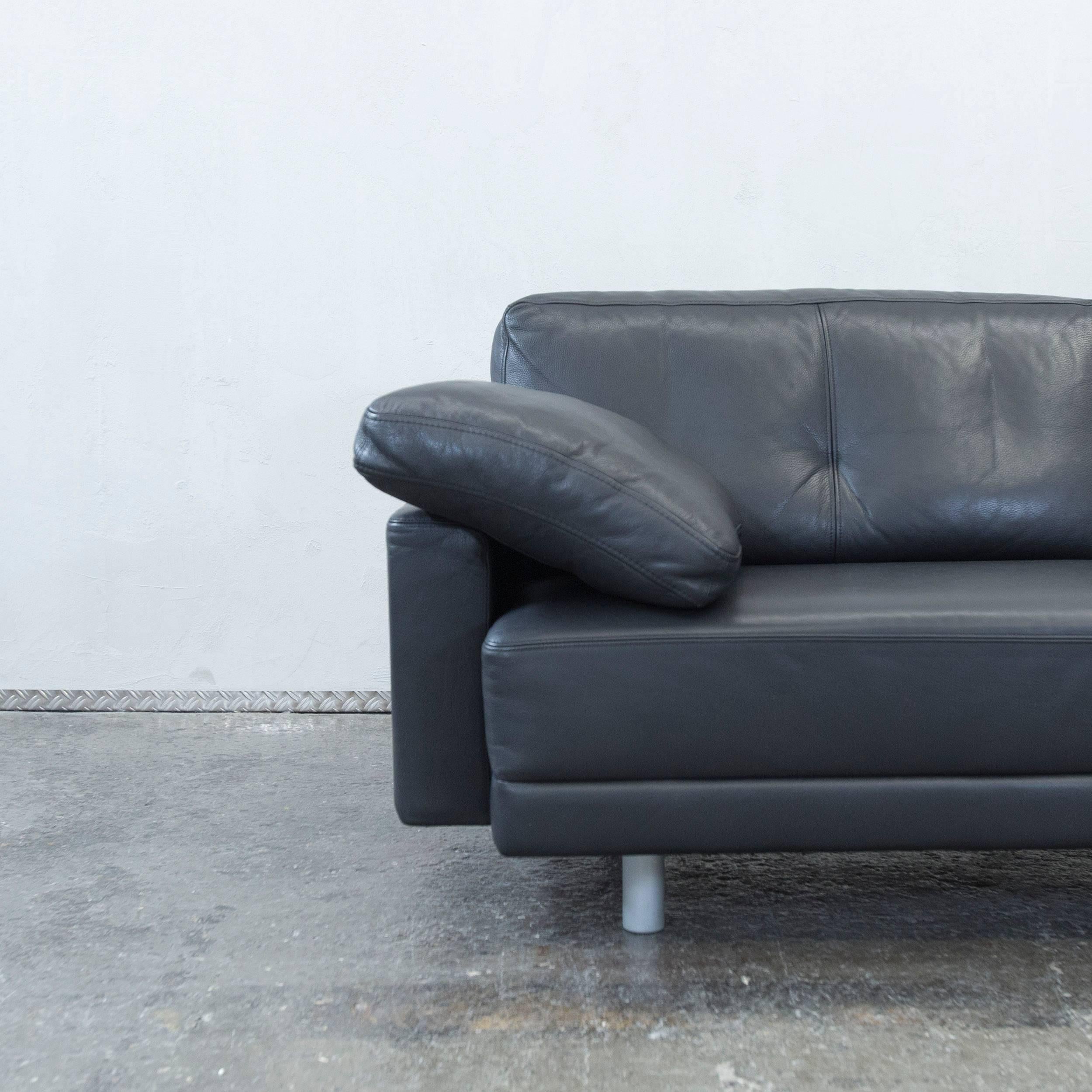 Black colored original Brühl Alba designer leather sofa in a minimalistic and modern design, made for pure comfort.