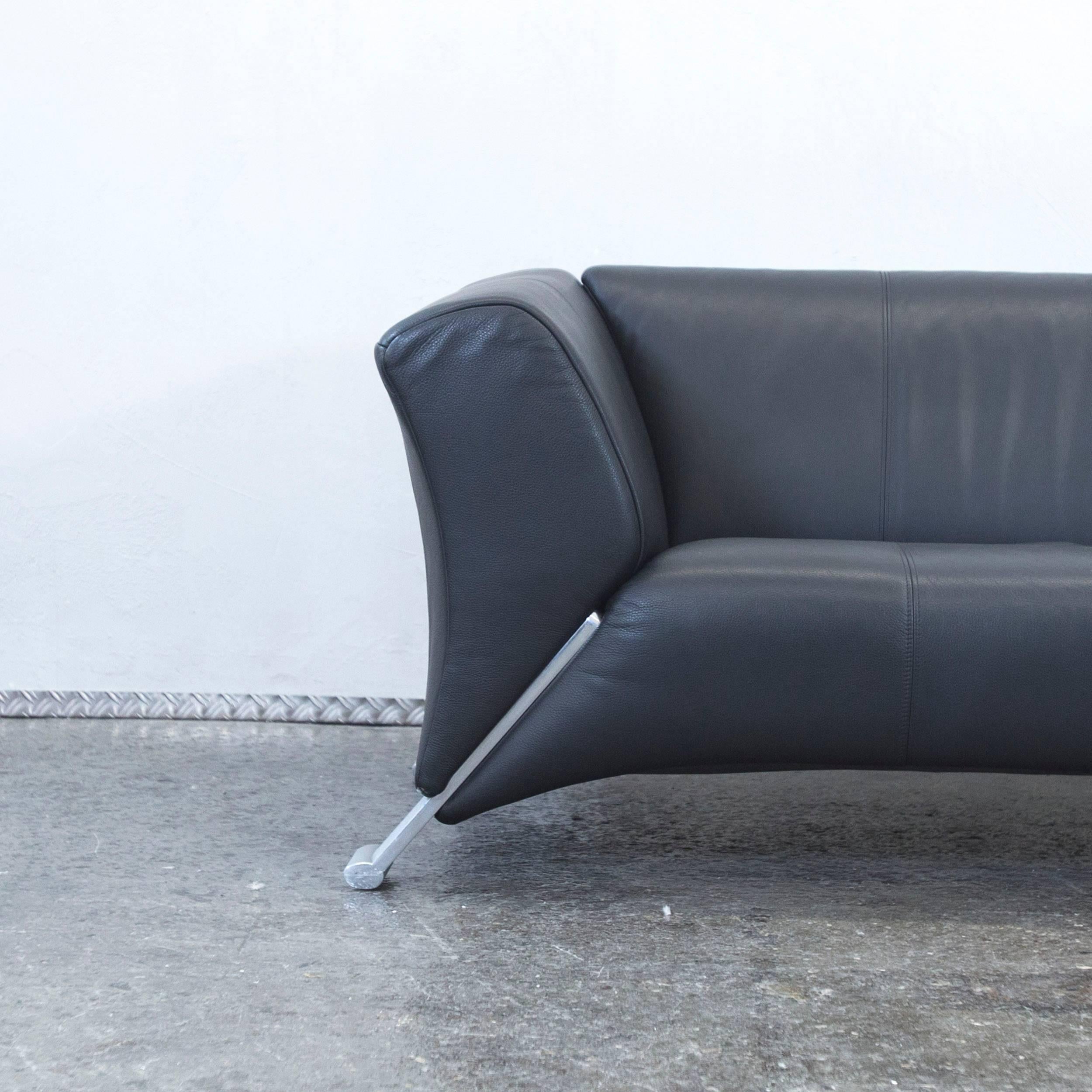 Black colored original Rolf Benz 322 designer leather sofa in a minimalistic and modern style.