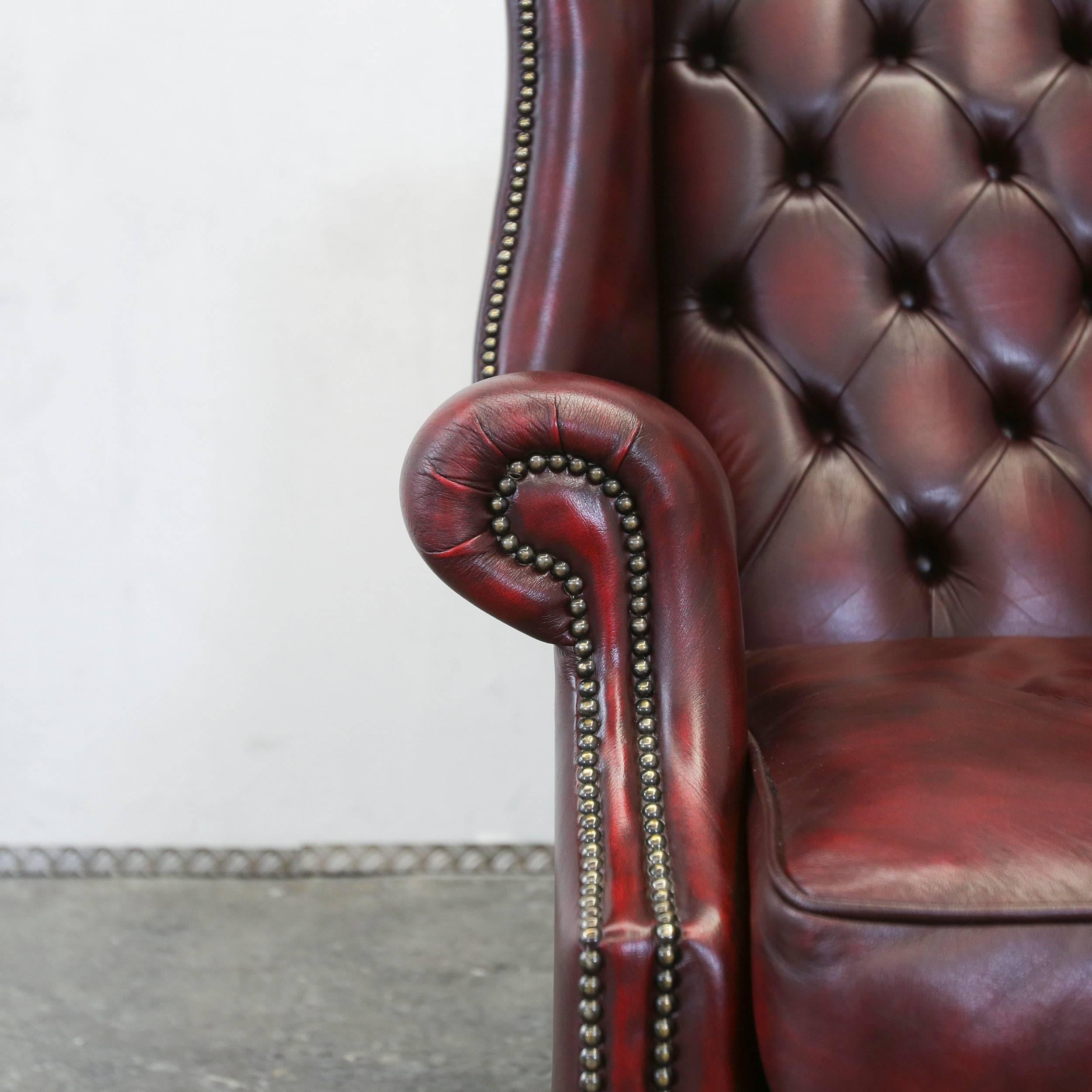 Oxblood red colored Chesterfield wingchair in a vintage and elegant style, made for pure comfort.