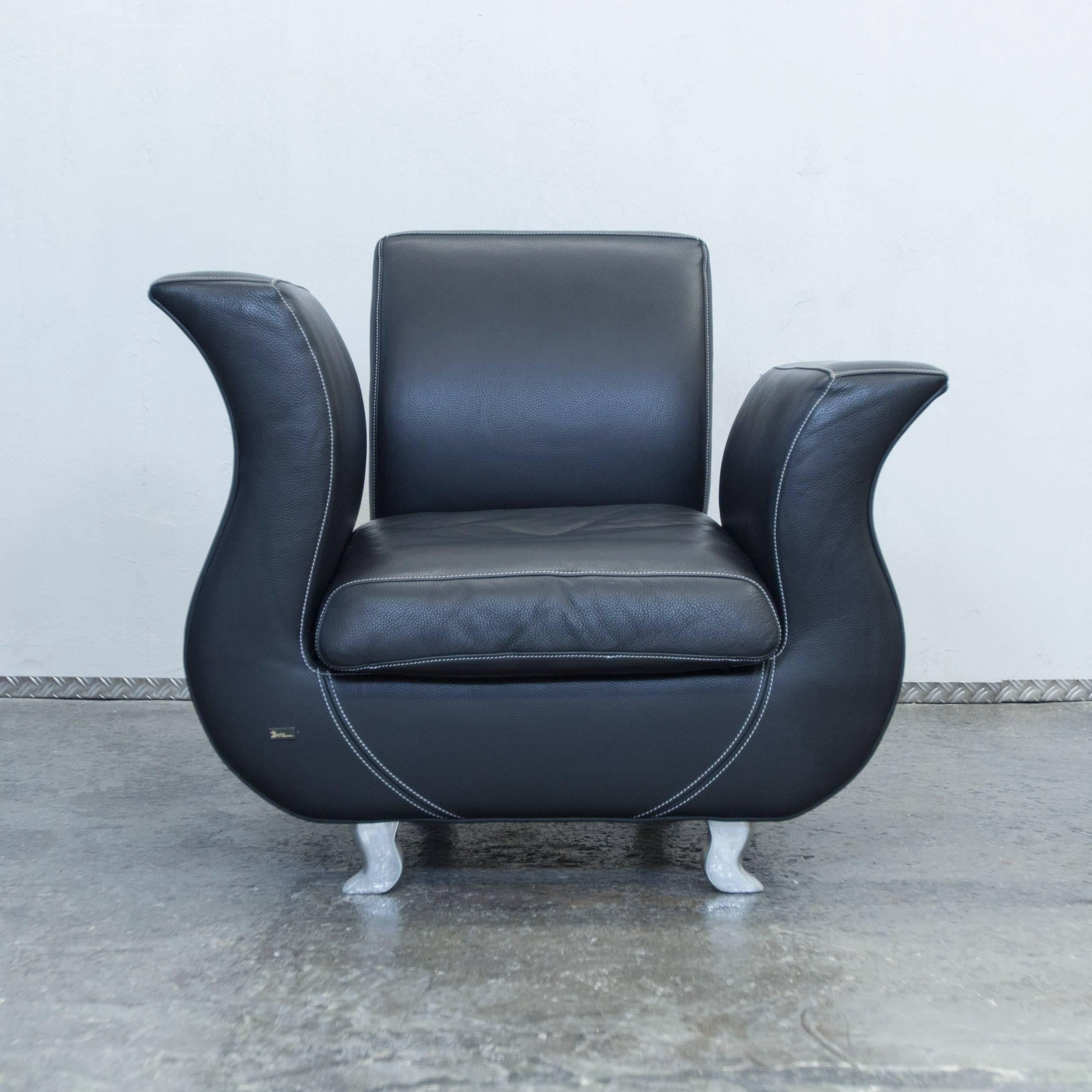 Black colored original Bretz Moon designer leather chair in a minimalistic and modern design, made for pure comfort and elegance.