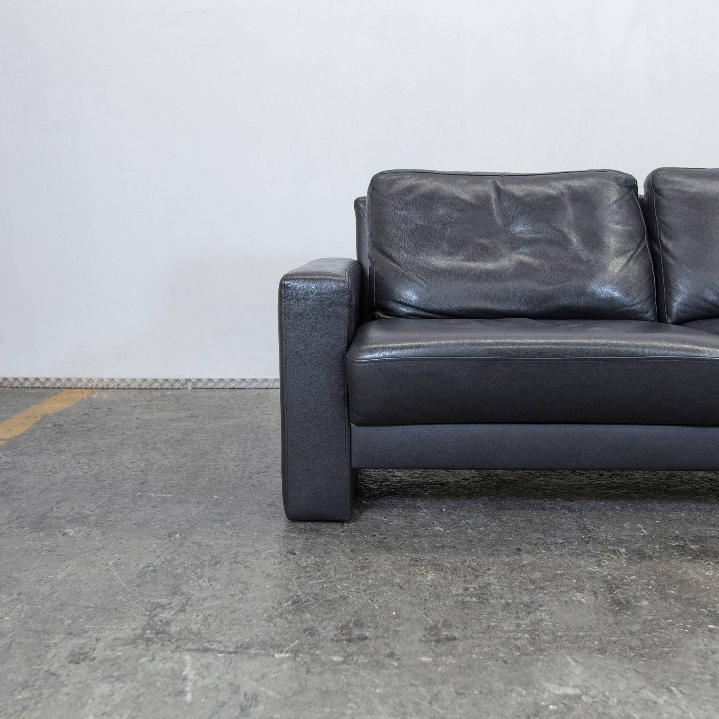 Black colored original Külkens & Sohn designer leather sofa in a minimalistic and modern design, made for pure comfort.