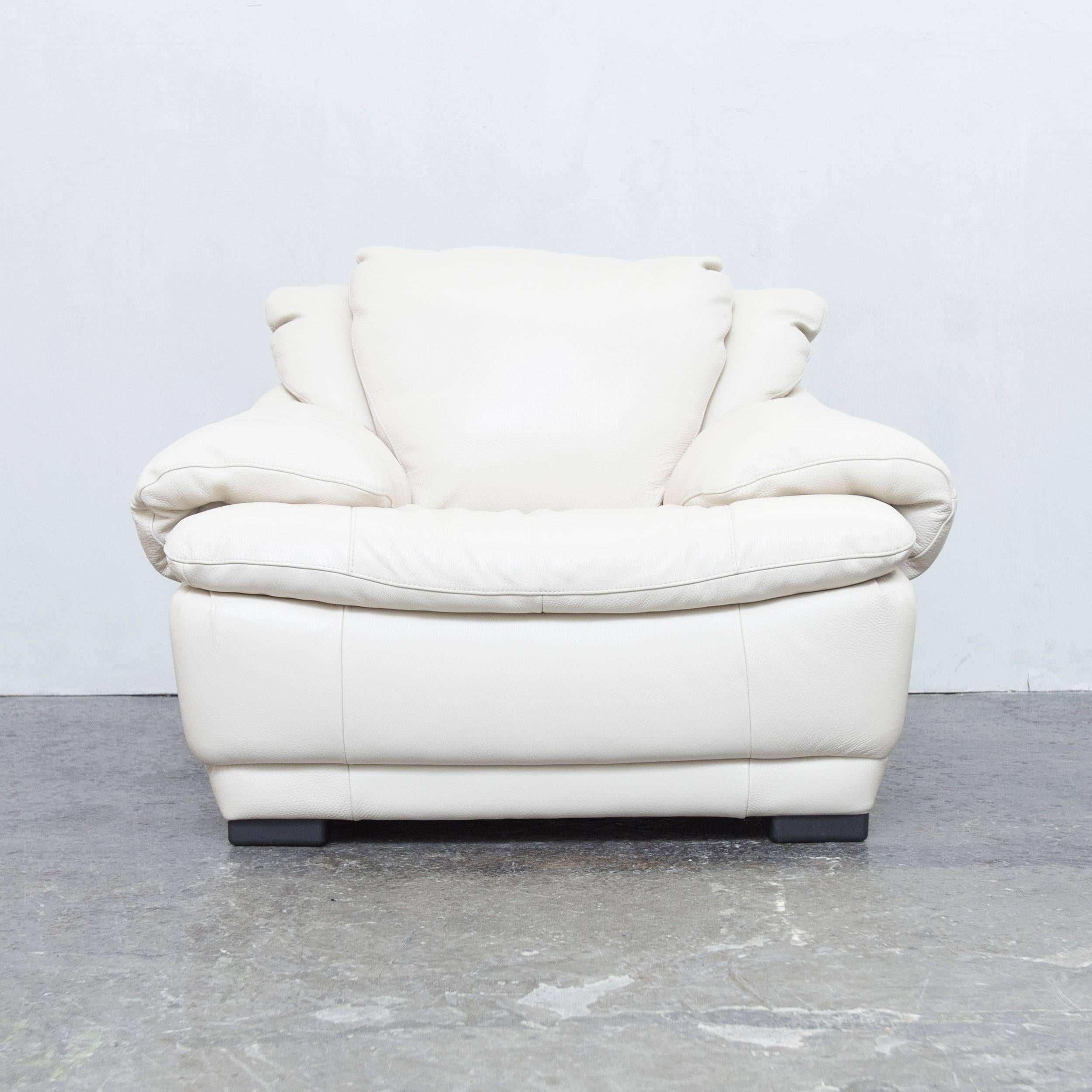 Creme white colored original Italsofa by Natuzzi designer leather chair in a minimalistic and modern design, made for pure comfort.
