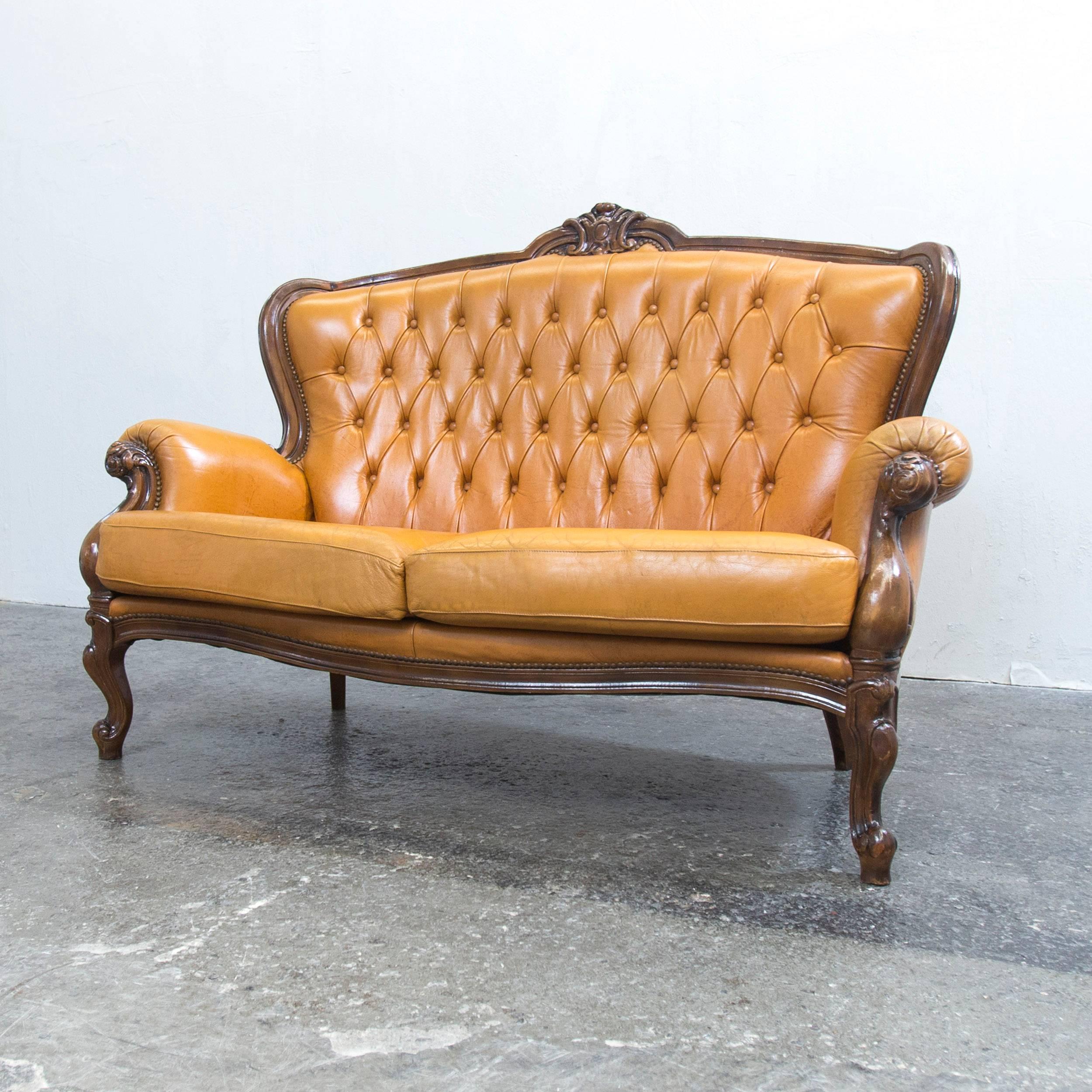 Cognac brown colored Chesterfield leather sofa in a vintage style, designed for pure elegance and comfort.