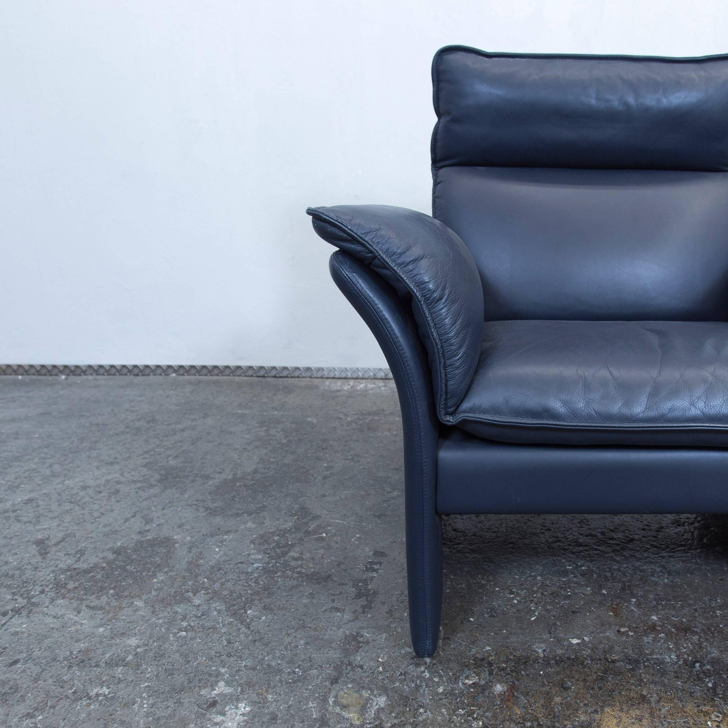 Blue colored original Dreipunkt designer leather armchair in a modern design, made for pure comfort.