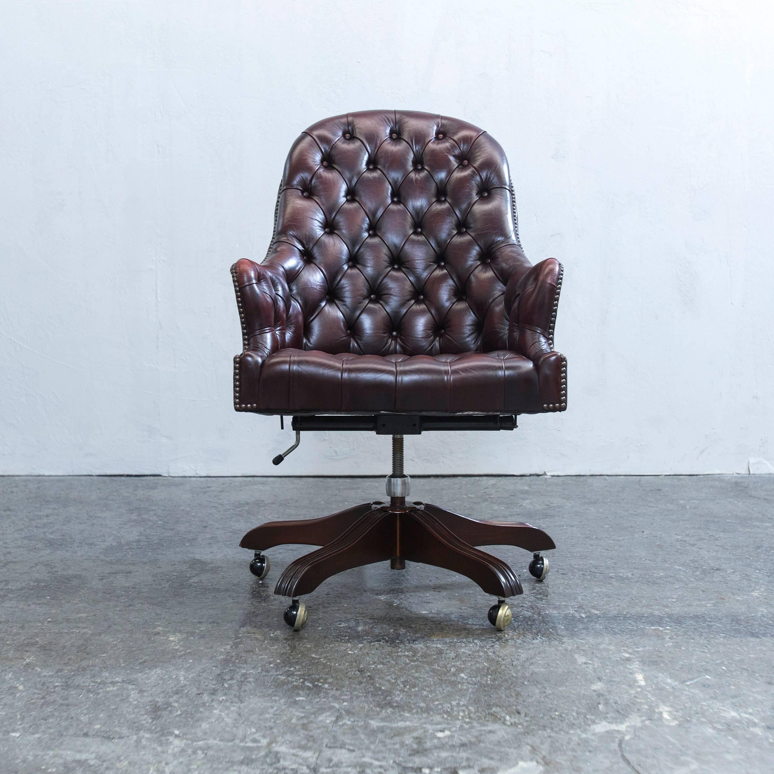 Brown colored original Wade Chesterfield leather revolving chair in an elegant design, made for pure comfort and functionality.