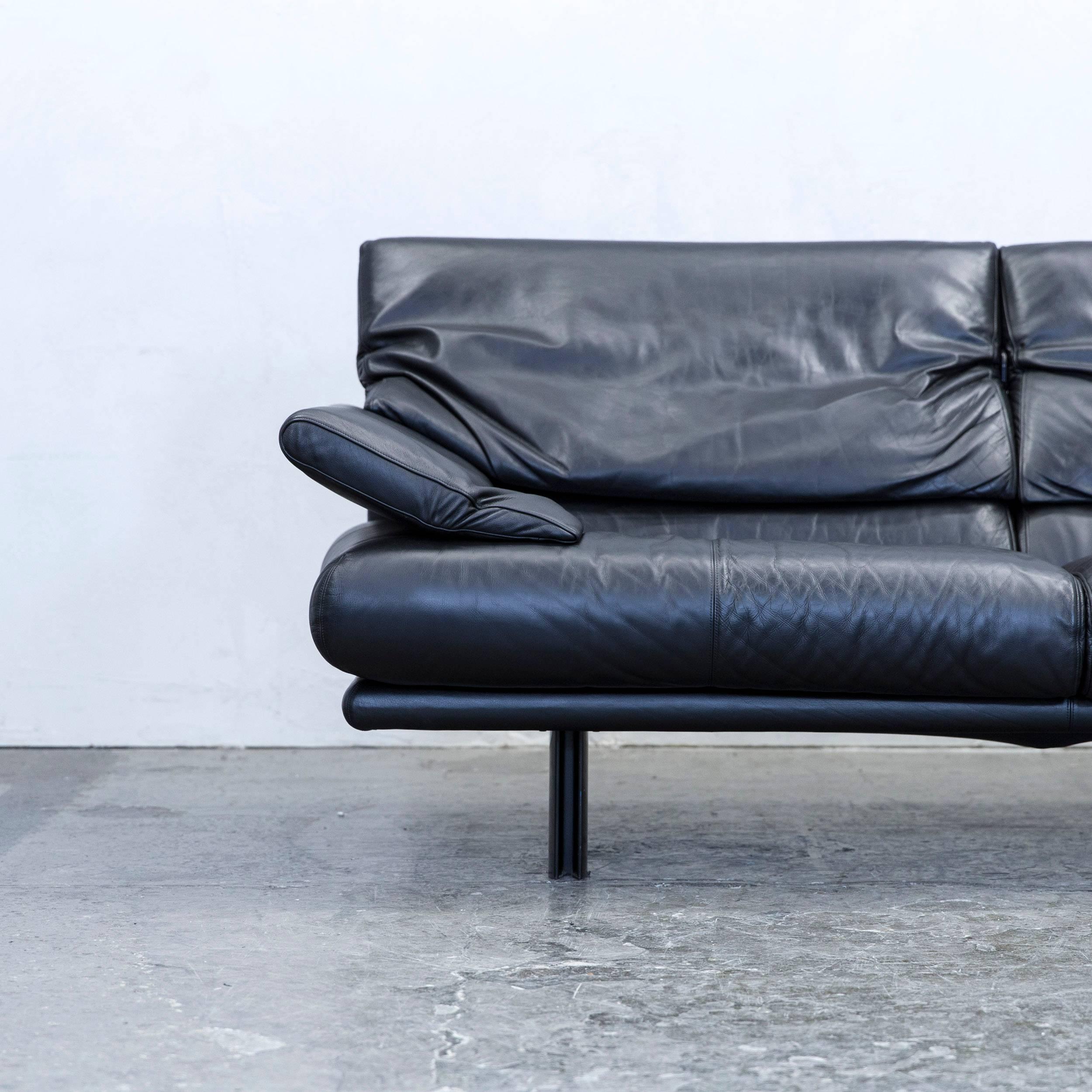 Black colored original B&B Italia Alanda designer leather sofa in a minimalistic and modern design, with convenient functions, made for pure comfort and flexibility.