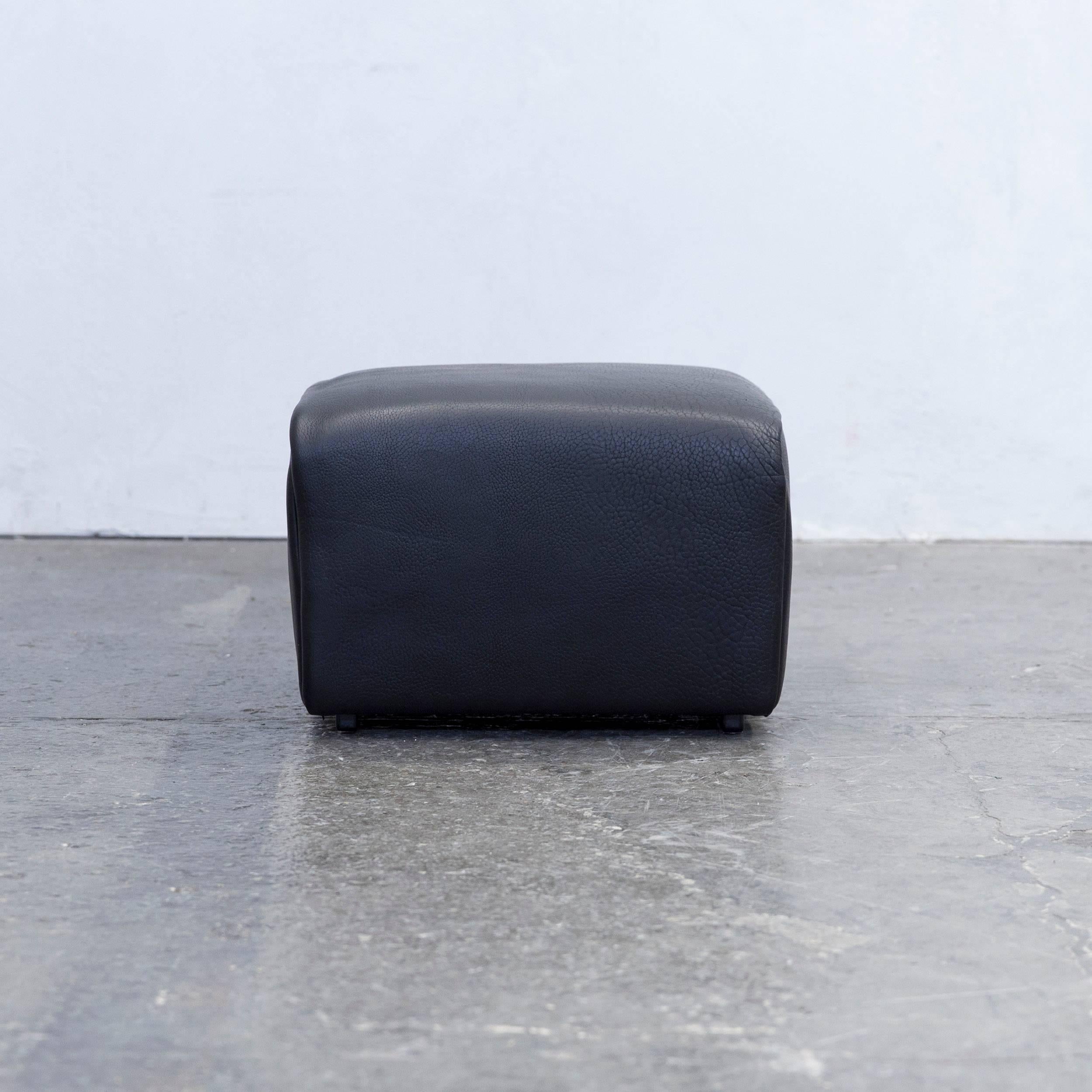 Black colored original De Sede DS 47 designer leather footstool in a minimalistic and modern design, made out of thick neck leather.