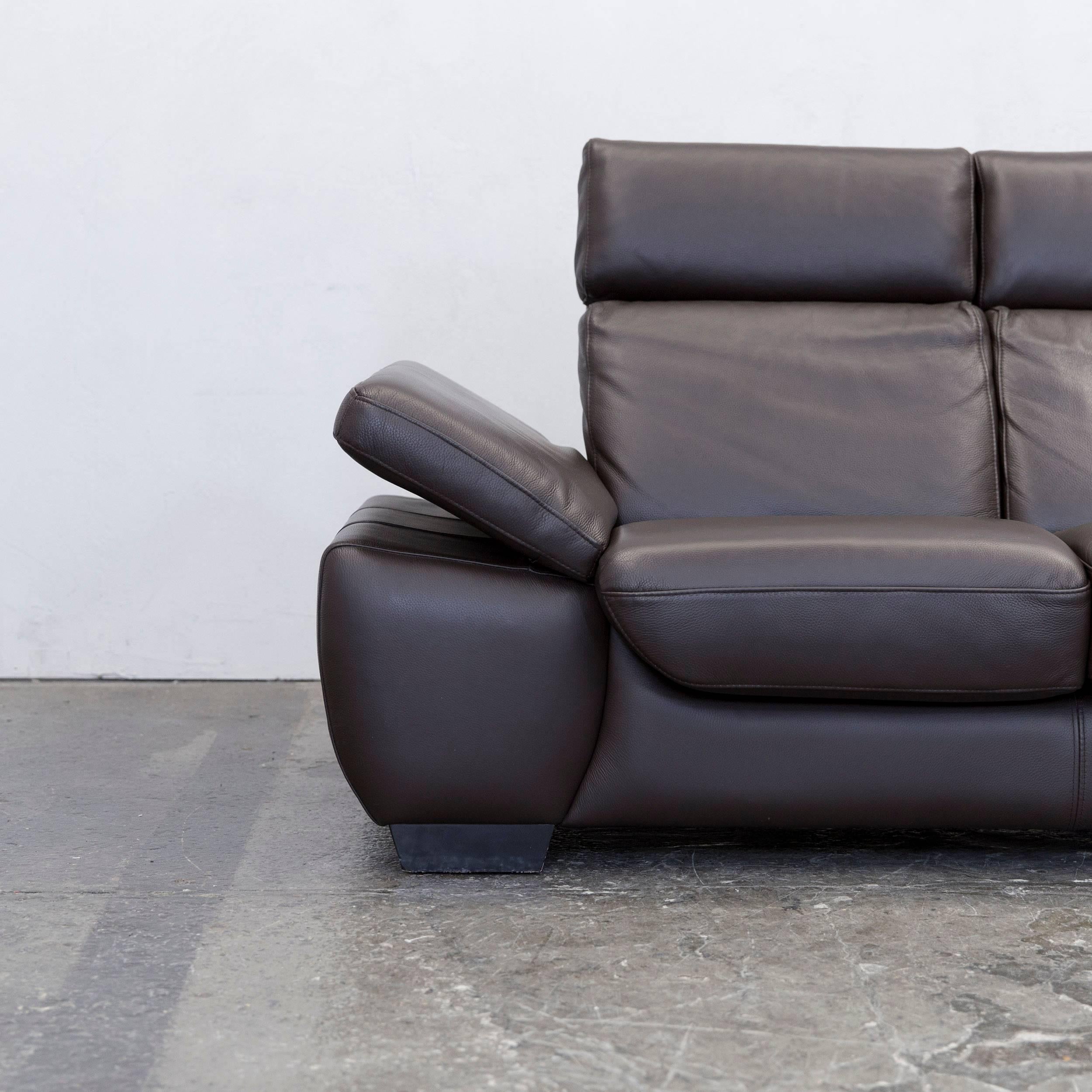Modern three-seat in authentic brown leather with recline function.