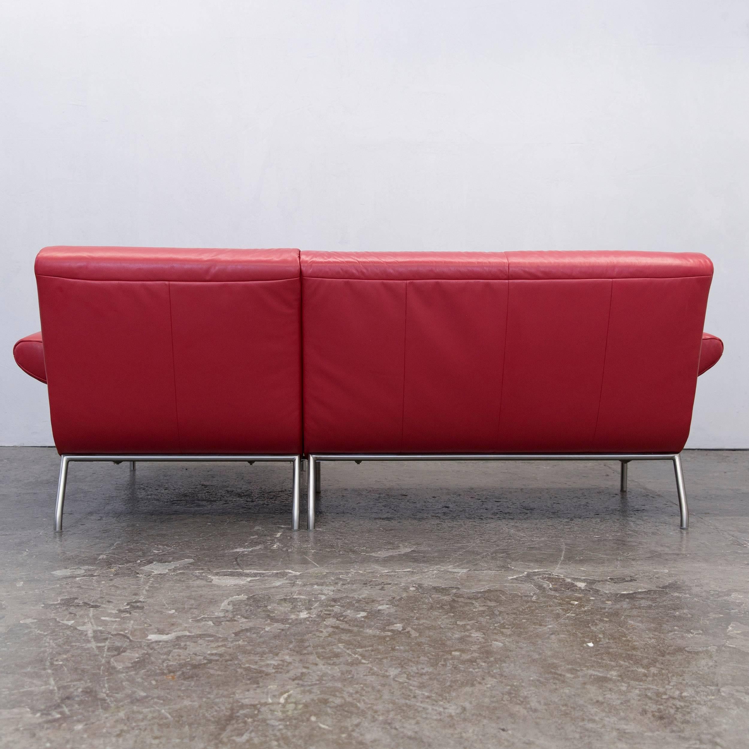 Modern Koinor corner couch in authentic red leather.