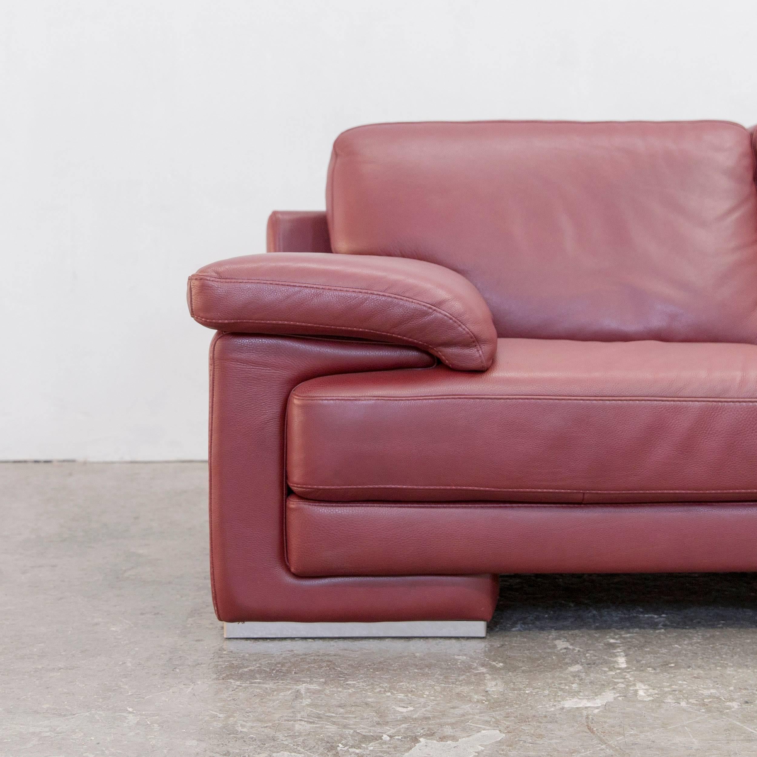 Authentic leather Natuzzi couch in red.
