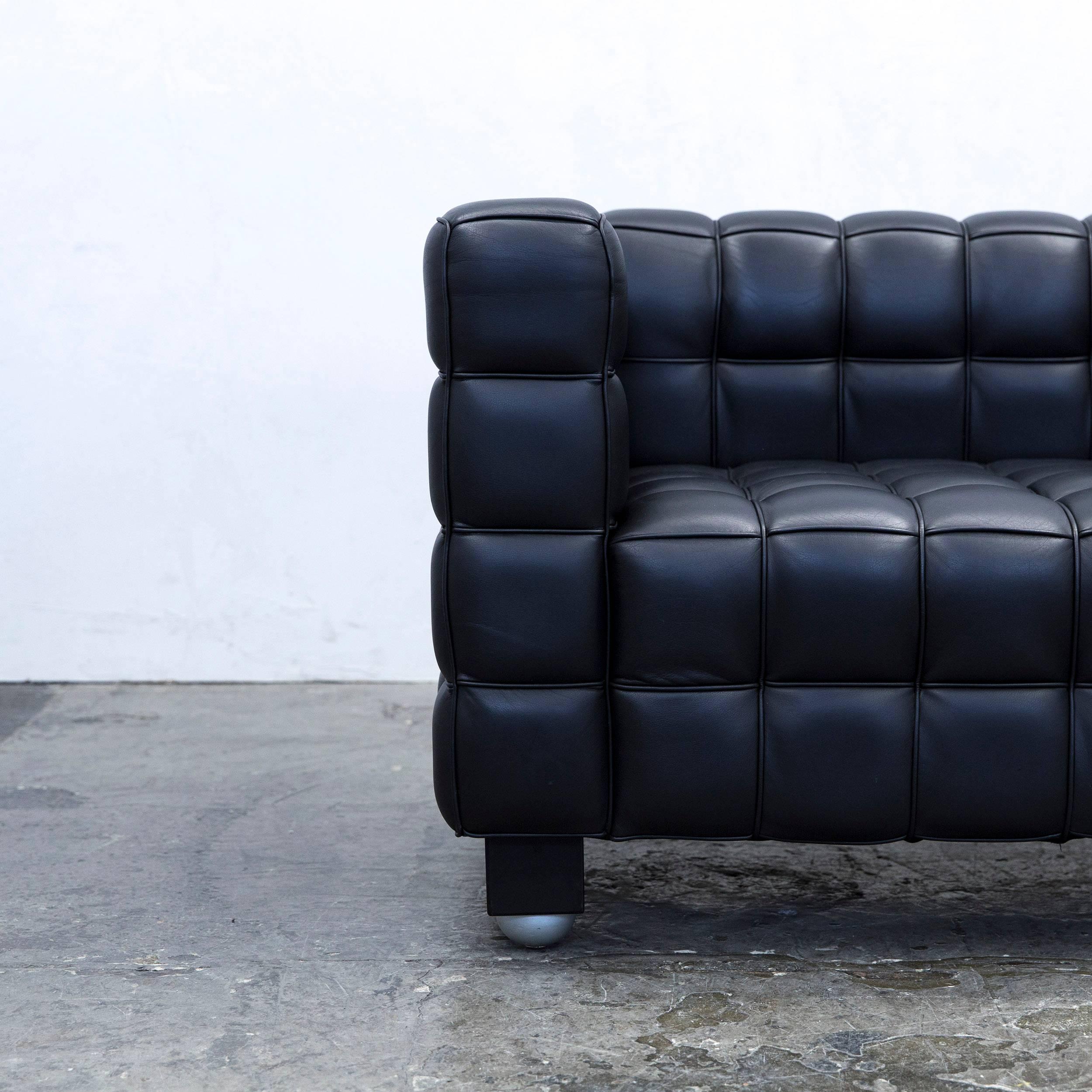 Black colored original Wittmann Kubus designer leather sofa in a minimalistic and modern design, made for pure comfort and style.