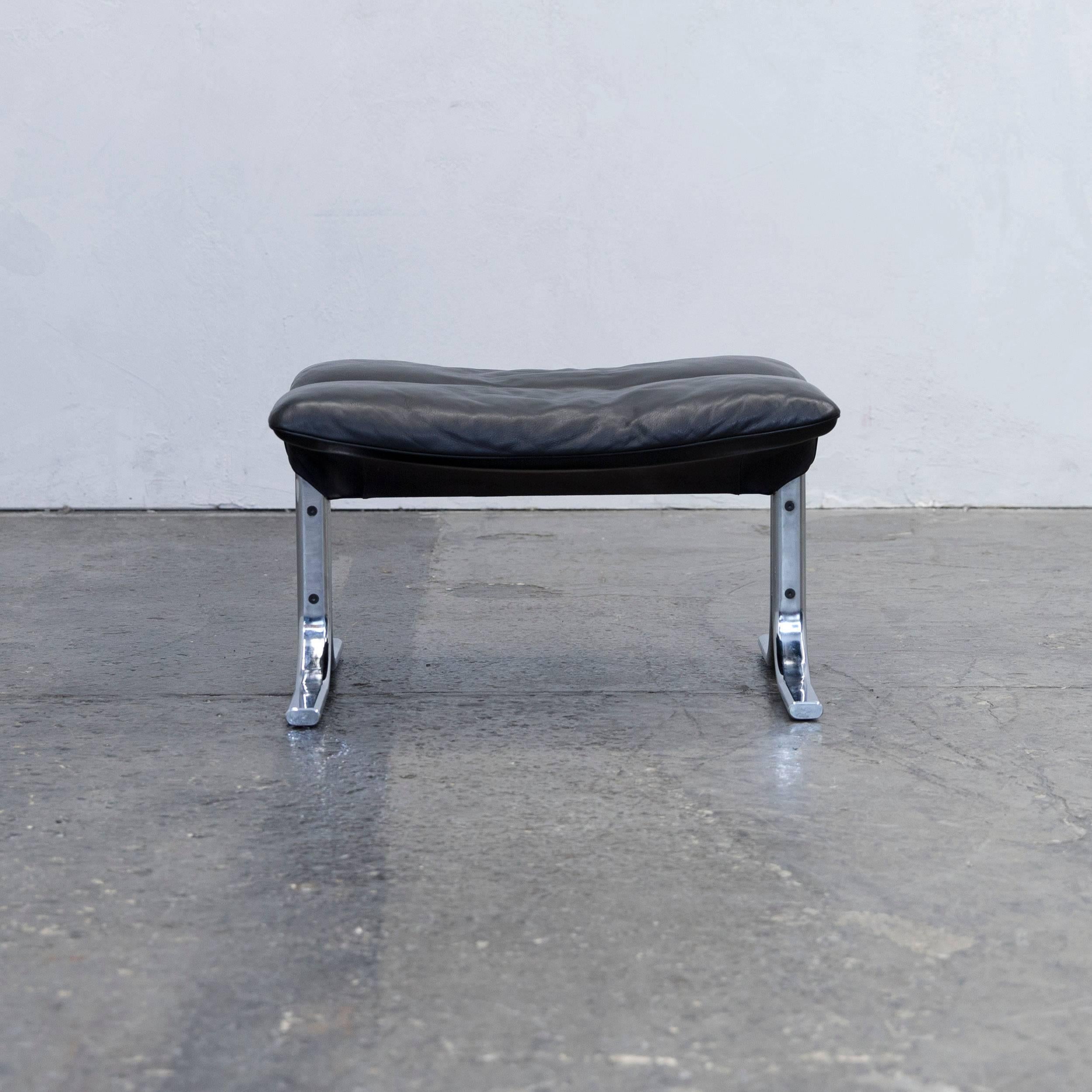 Black colored original De Sede designer leather footstool in a minimalistic and modern design, made for pure comfort.