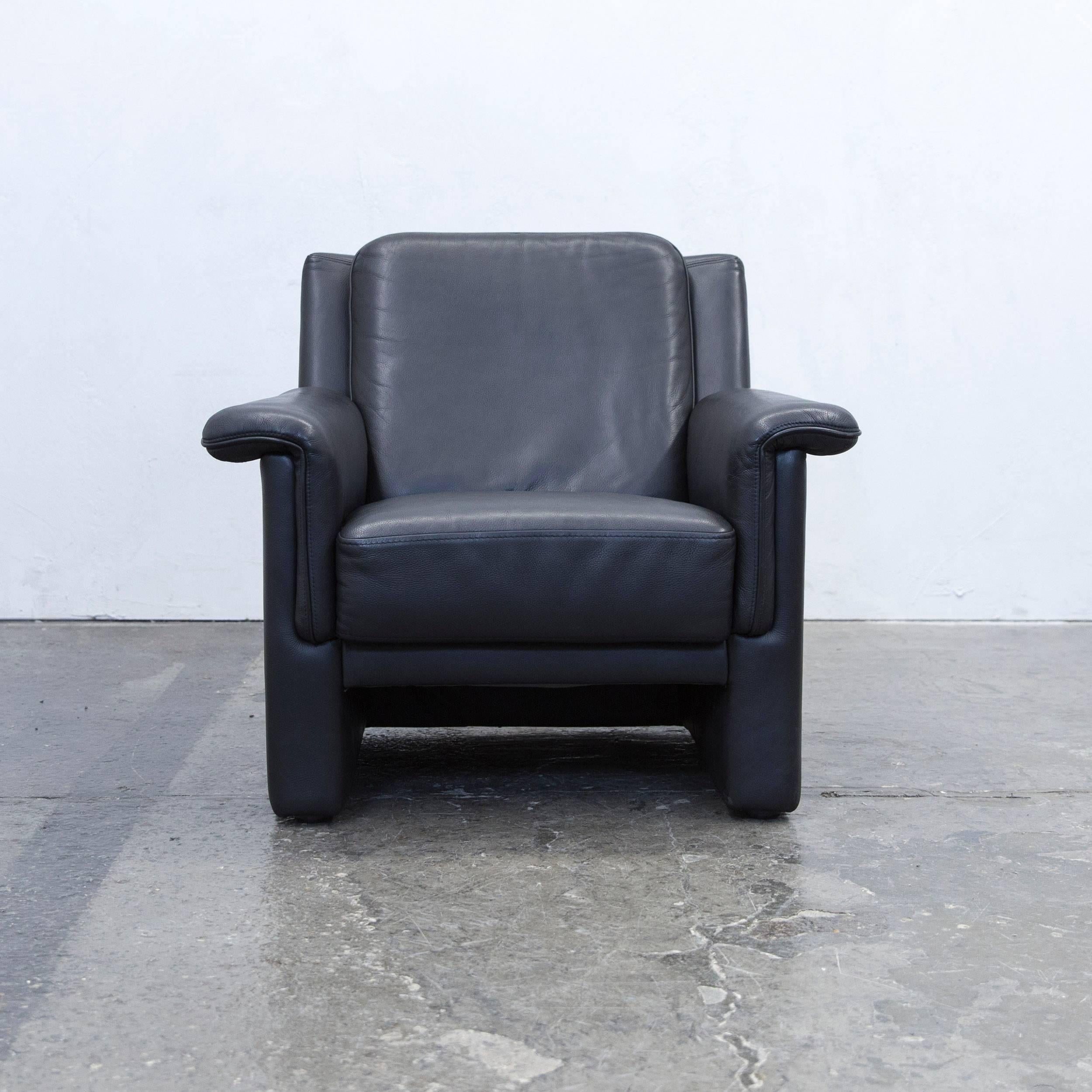 Black colored original Brühl & Sippold designer leather armchair in a minimalistic and modern design, made for pure comfort.