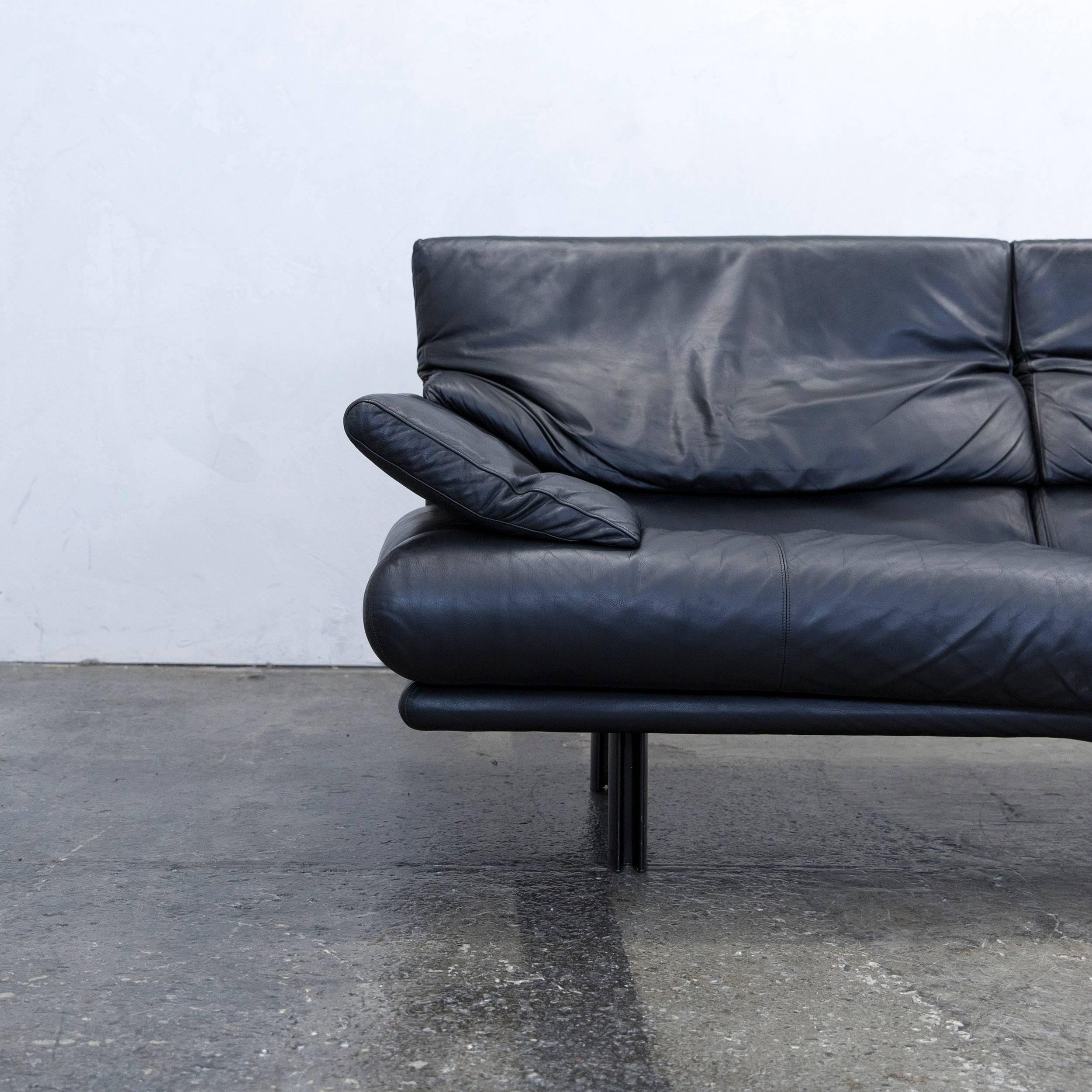 Black colored original B&B Italia Alanda designer leather sofa, in a minimalistic and modern design, with convenient functions, made for pure comfort and flexibility.