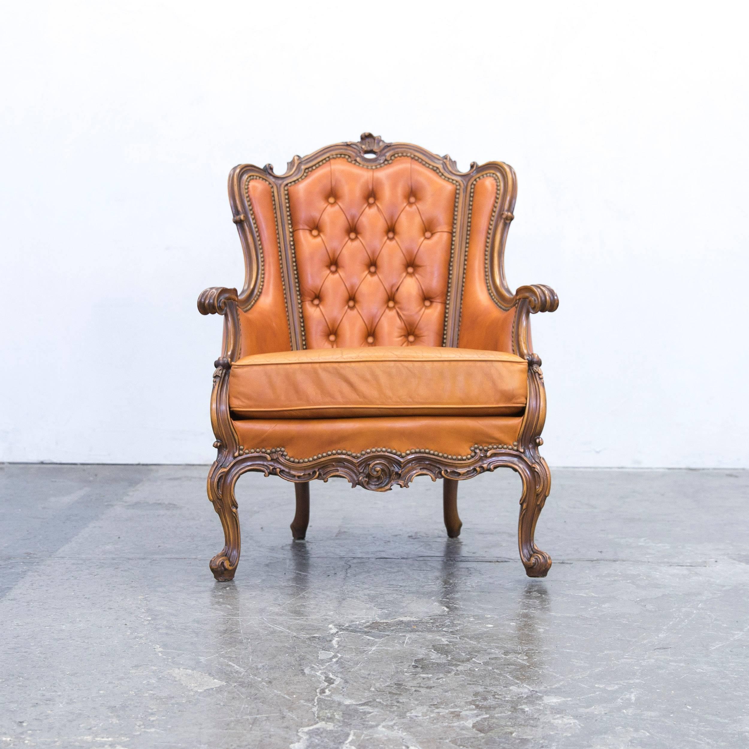 Cognac brown colored original Chesterfield leather armchair in a vintage design, made for pure comfort and elegance.