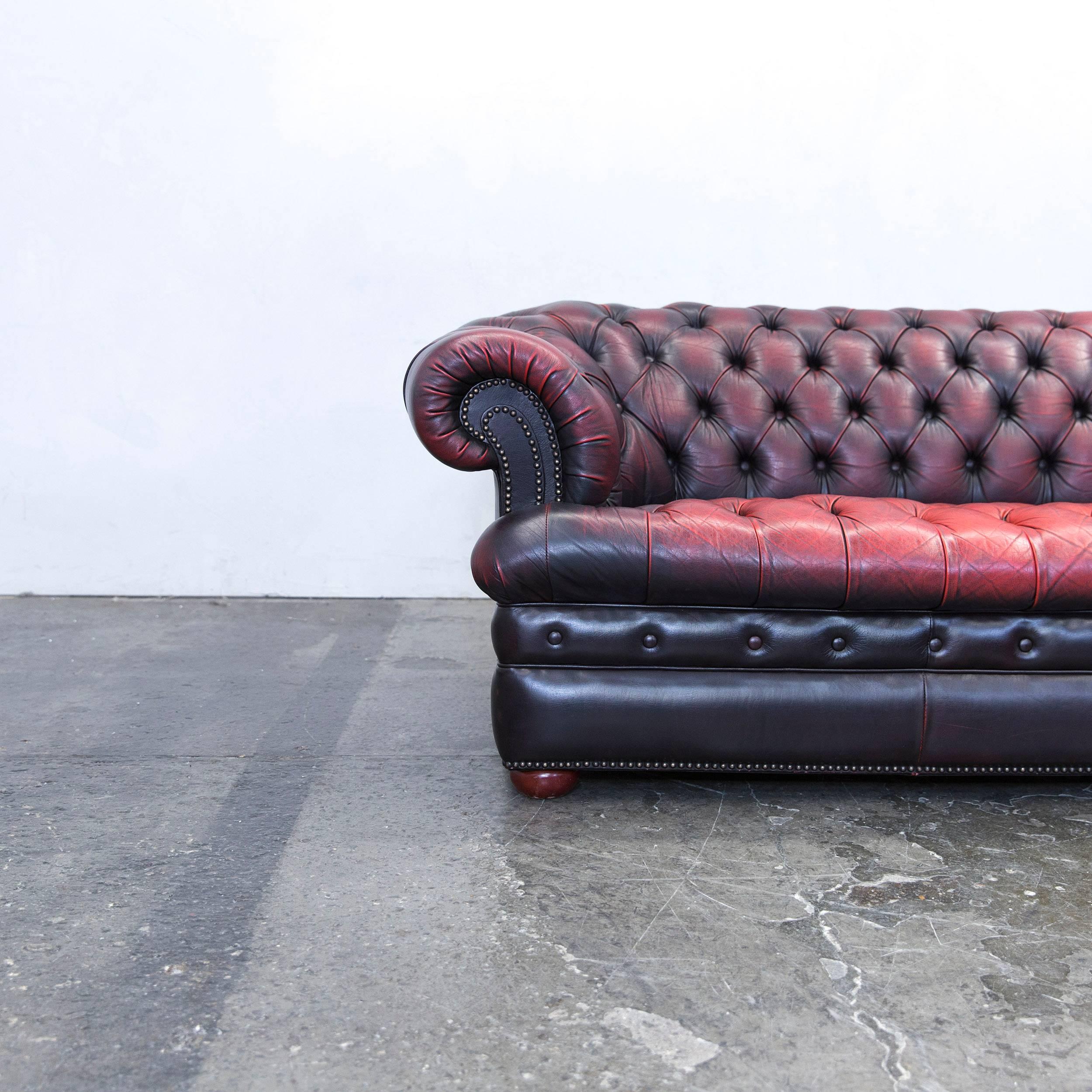 Red brown colored Chesterfield leather sofa in a vintage design, made for pure comfort and elegance.