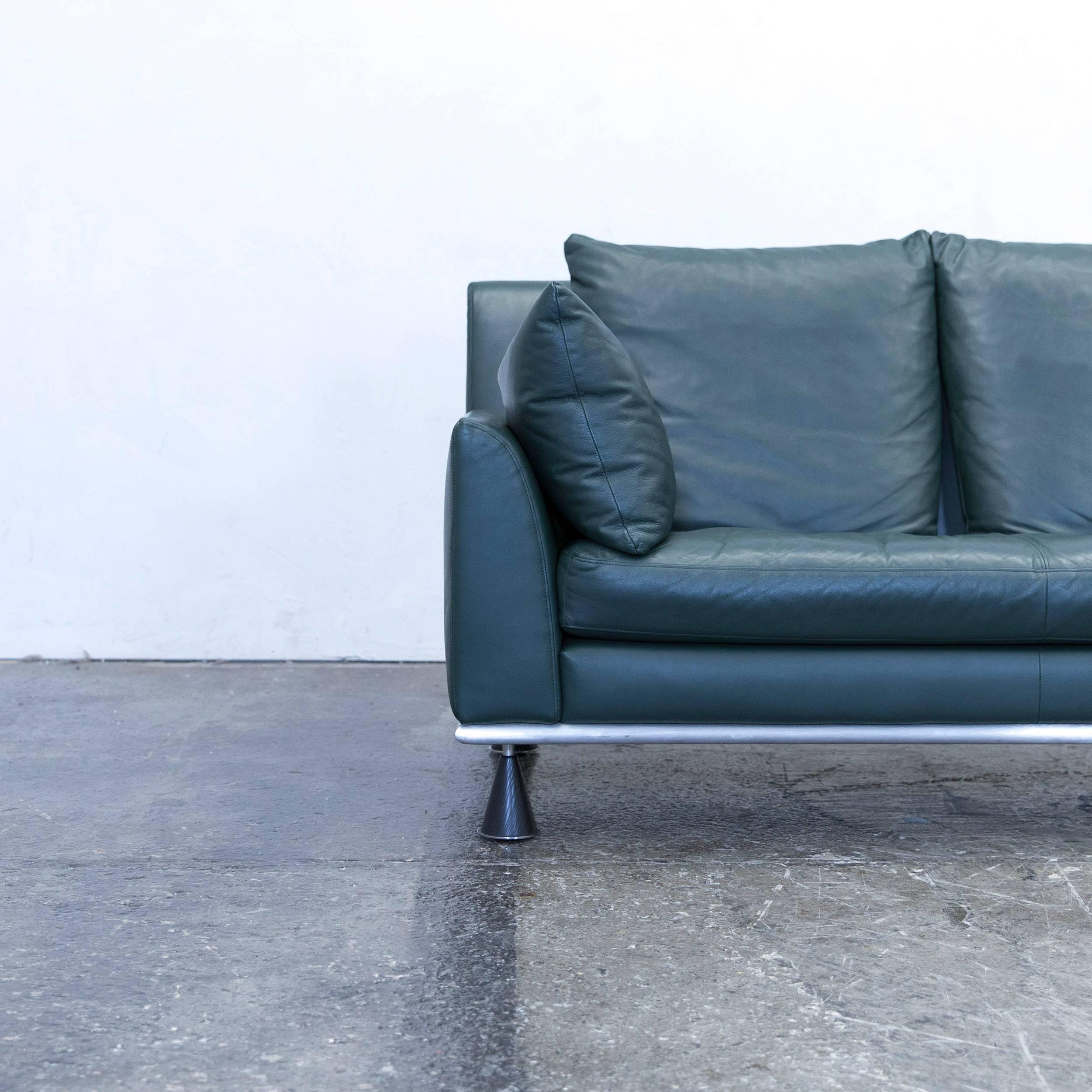 Green colored original Rolf Benz designer leather sofa in a minimalistic and modern design, made for pure comfort.