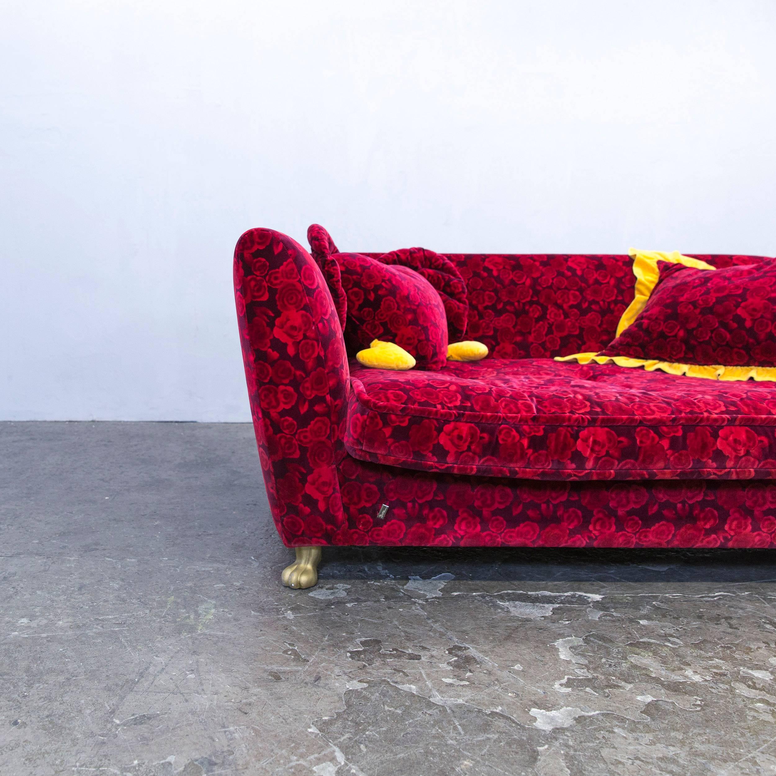 Red colored original Bretz Monster designer sofa in an elegant style with a floral pattern, made for pure comfort.