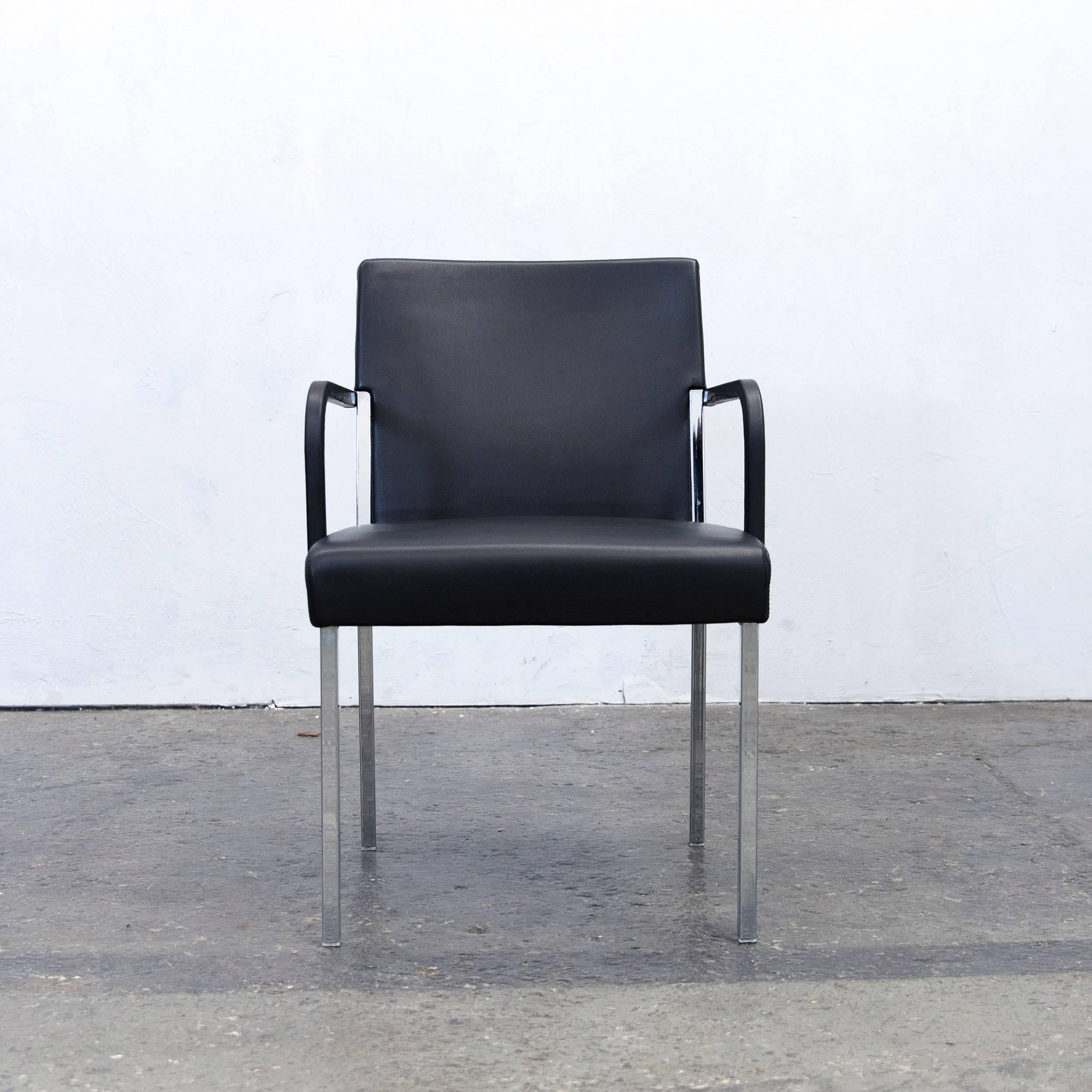 Black colored original Moroso designer leather armchair, in a minimalistic and modern design, made for pure comfort and style.