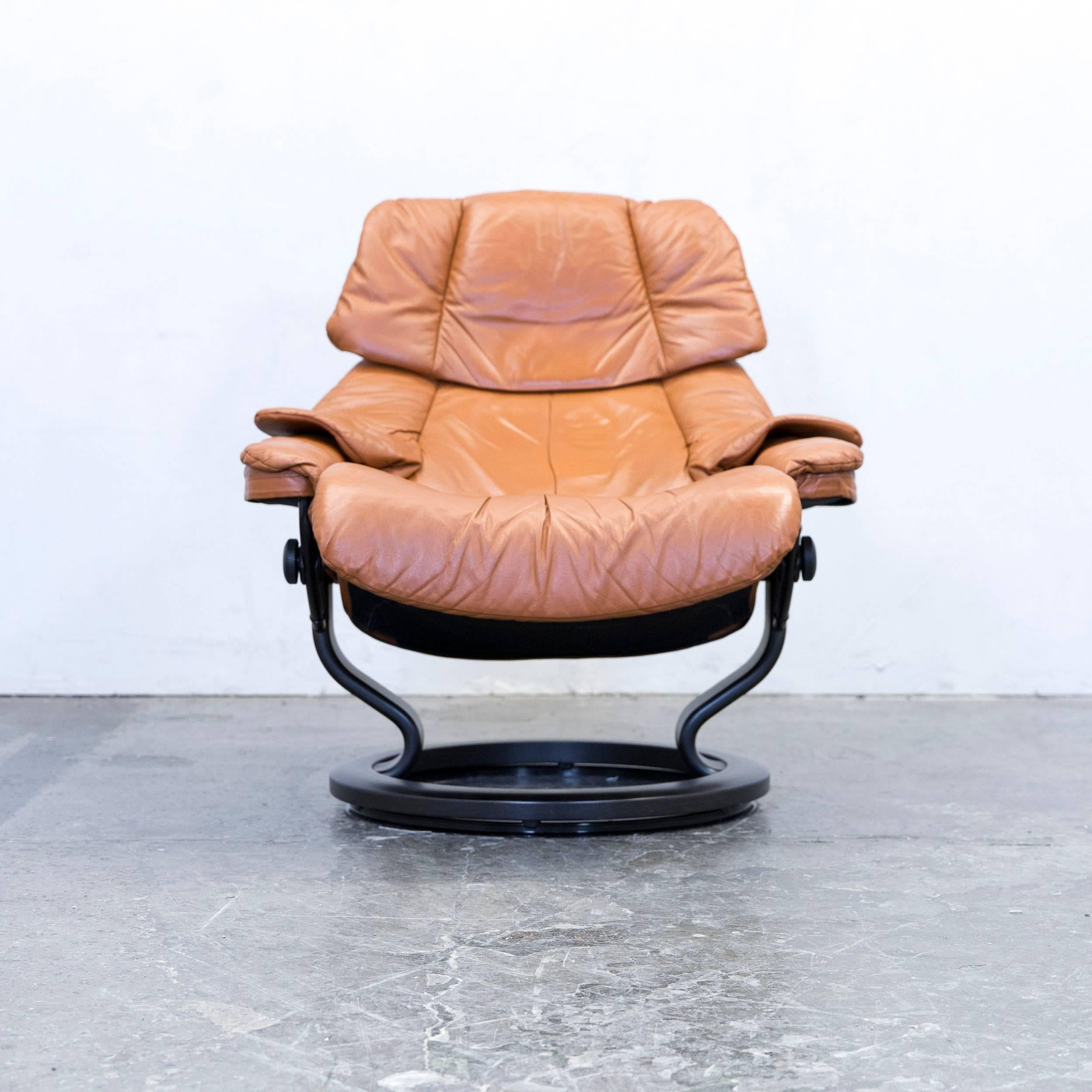 Ocre brown colored original Stressless designer leather Swivel chair in a minimalistic and modern design, with convenient functions, made for pure comfort and flexibility.
