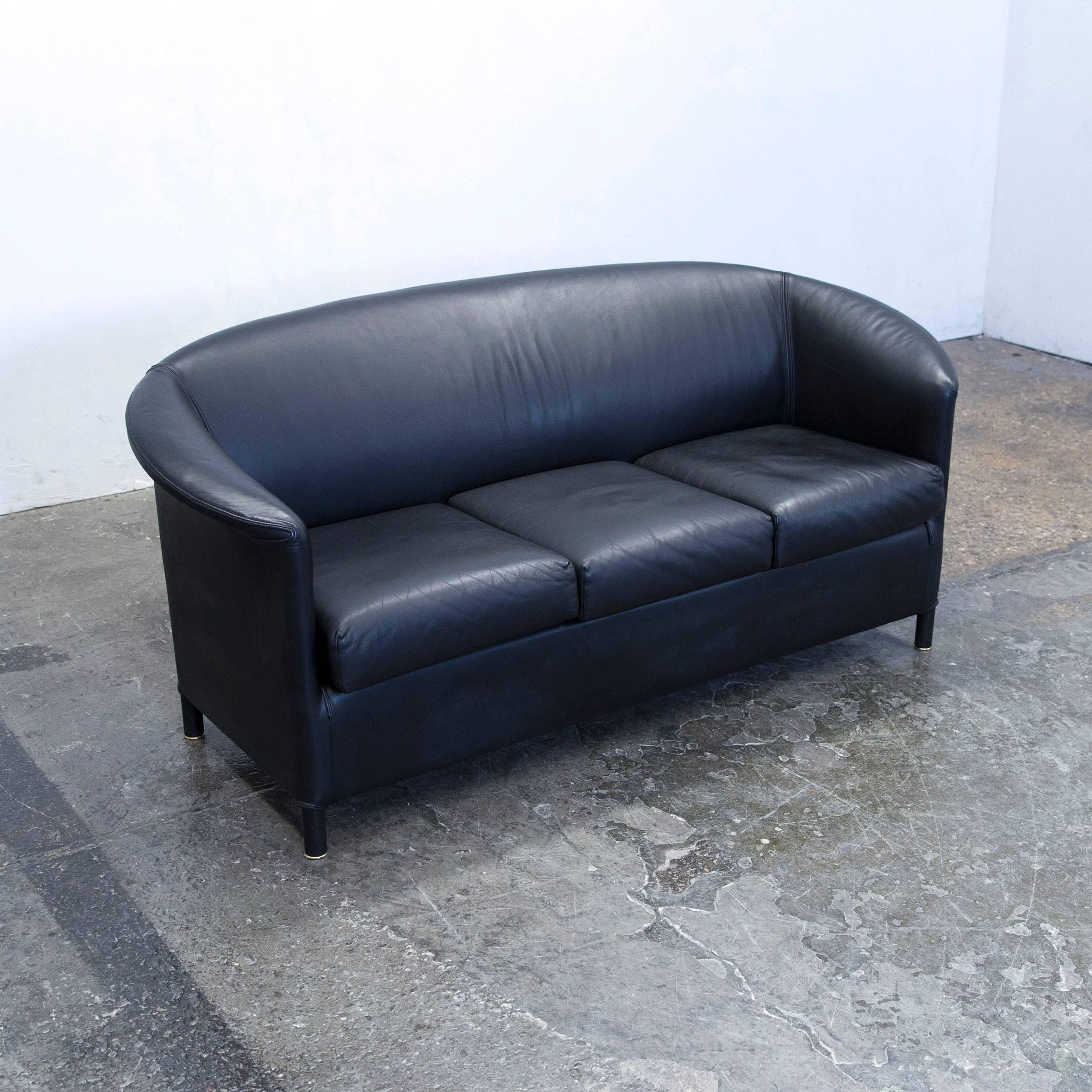 Black colored original Wittmann Aura designer leather sofa, in a minimalistic and modern design, made for pure comfort.