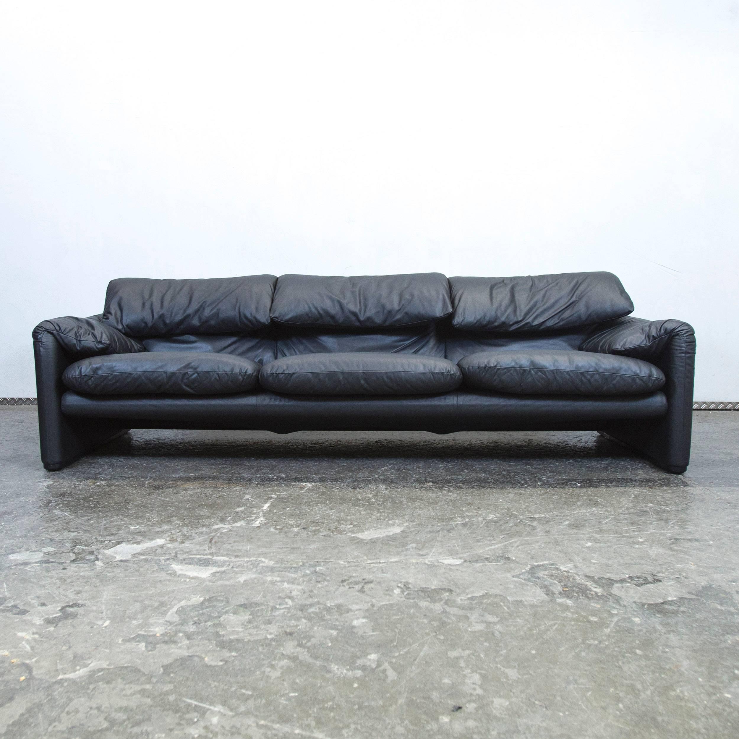 Black colored original Cassina Maralunga designer leather sofa, in a minimalistic and modern design, with convenient functions, made for pure comfort and style.