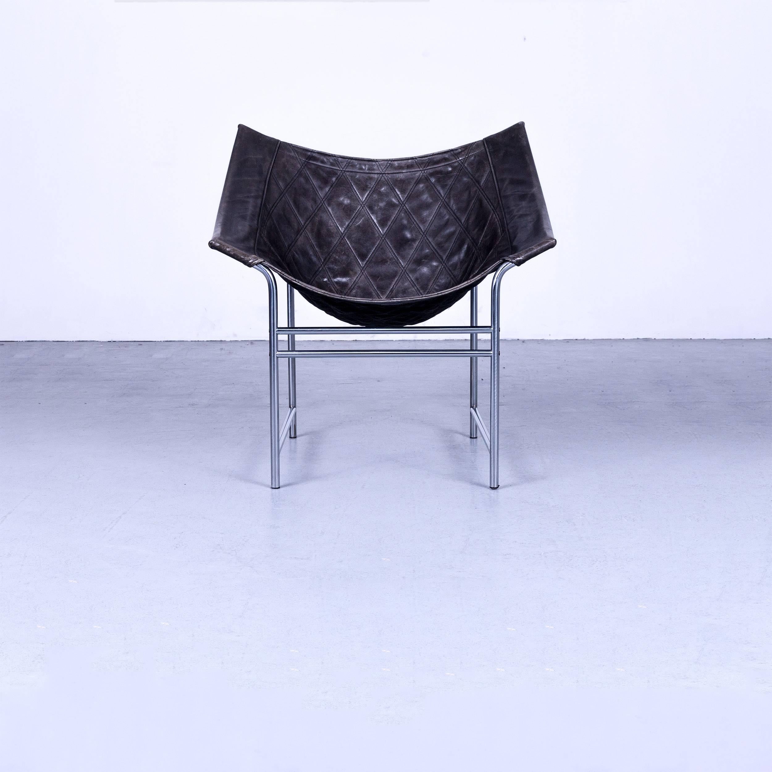 Montis butterfly design armchair with black leather and polished chrome-plated steel frame.
 