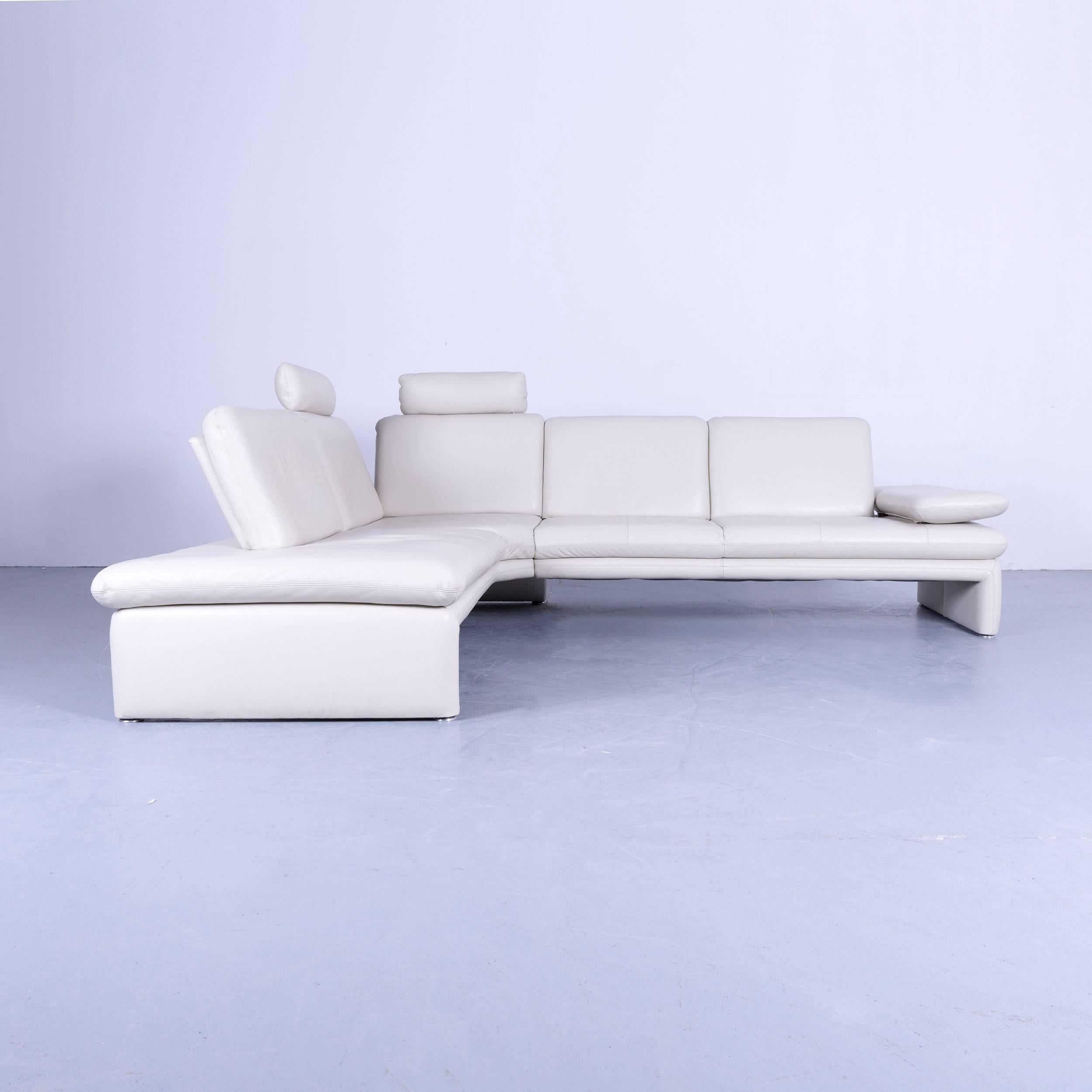 A corner sofa made in Germany by Willi Schillig in a nice white color with useful functions.