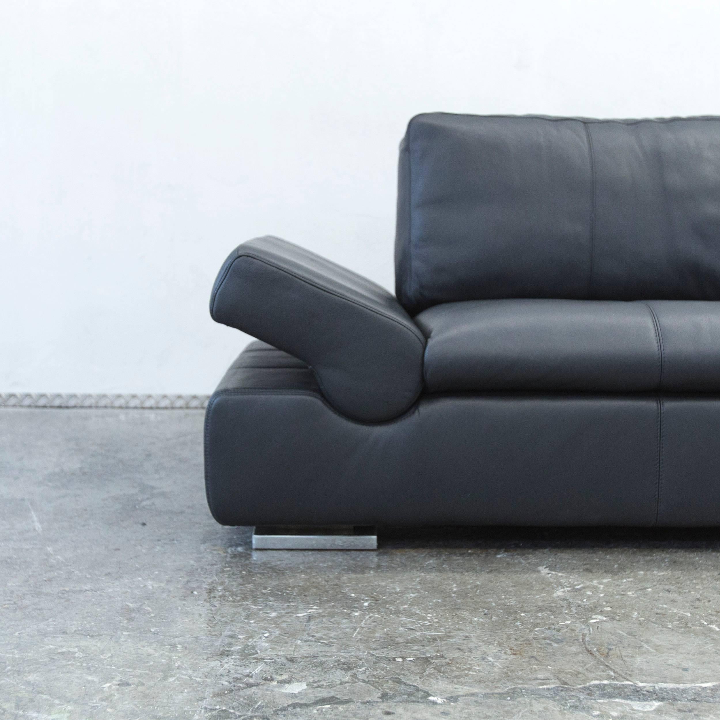 Black colored original Musterring Linea designer leather sofa with various convenient functions, designed to provide pure comfort.