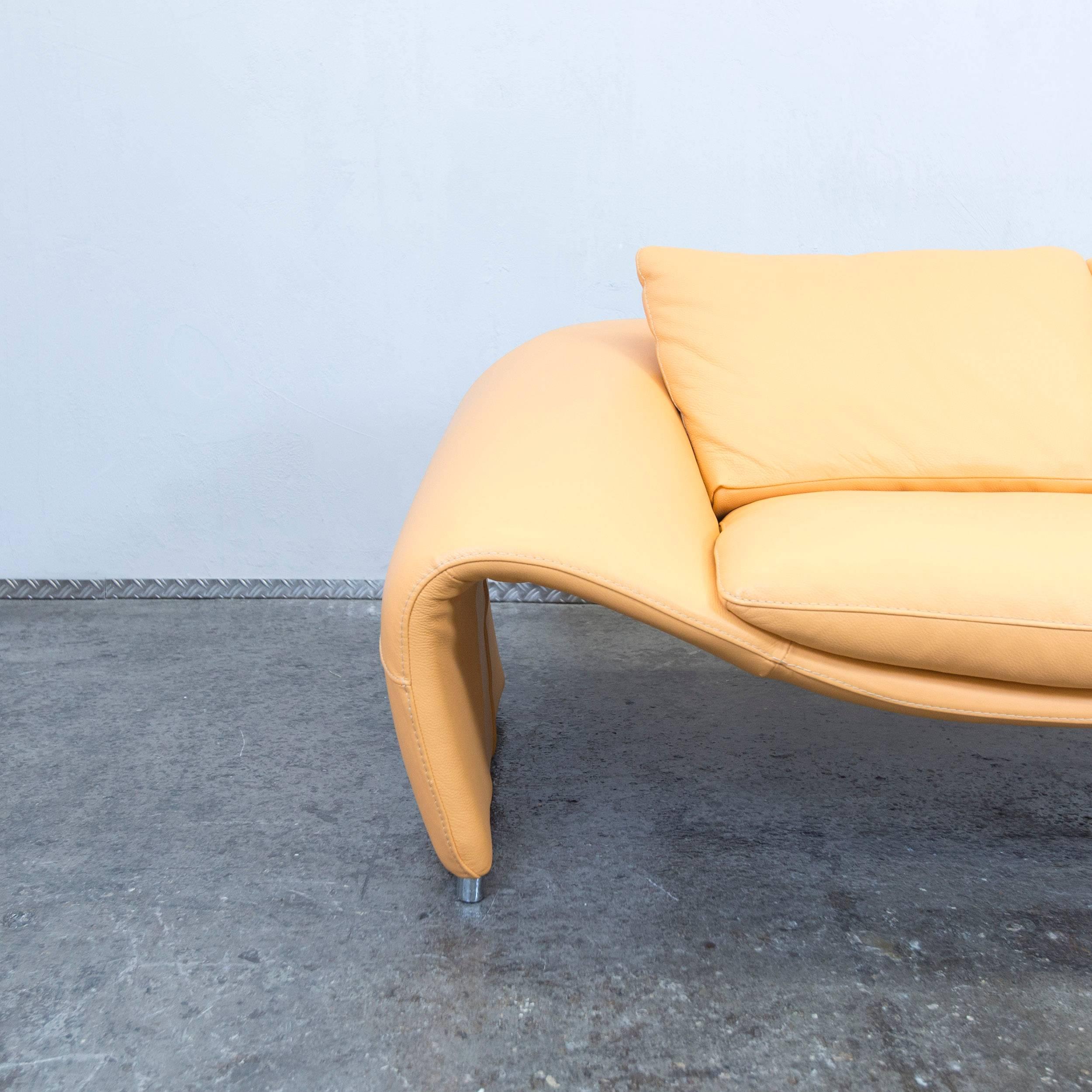 Yellow colored original Chateau d'Ax Voga designer leather sofa in a minimalistic and modern design.