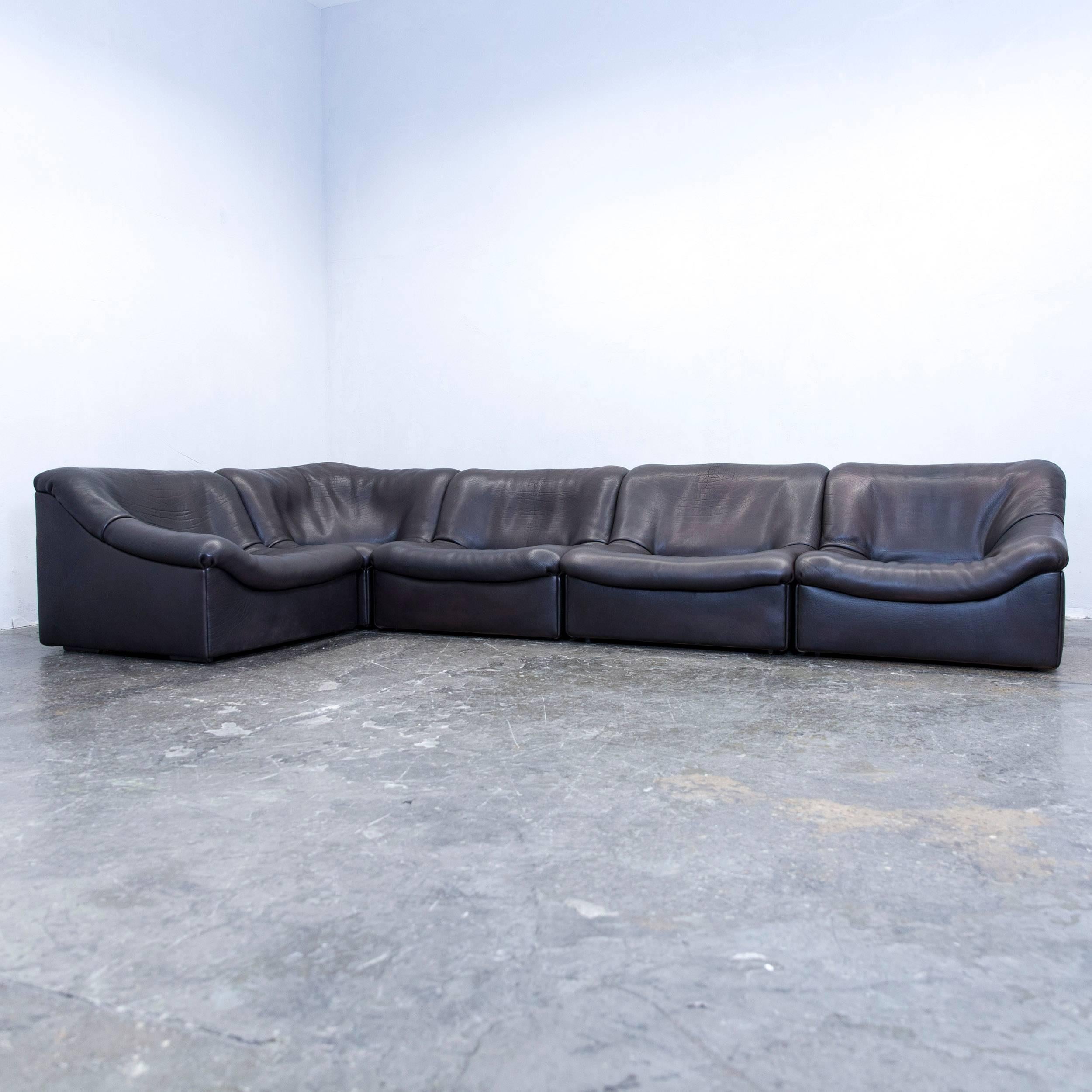 Black brown colored original De Sede DS designer leather corner sofa in a minimalistic and modern design, with a convenient modular function, made for pure comfort and flexibility.