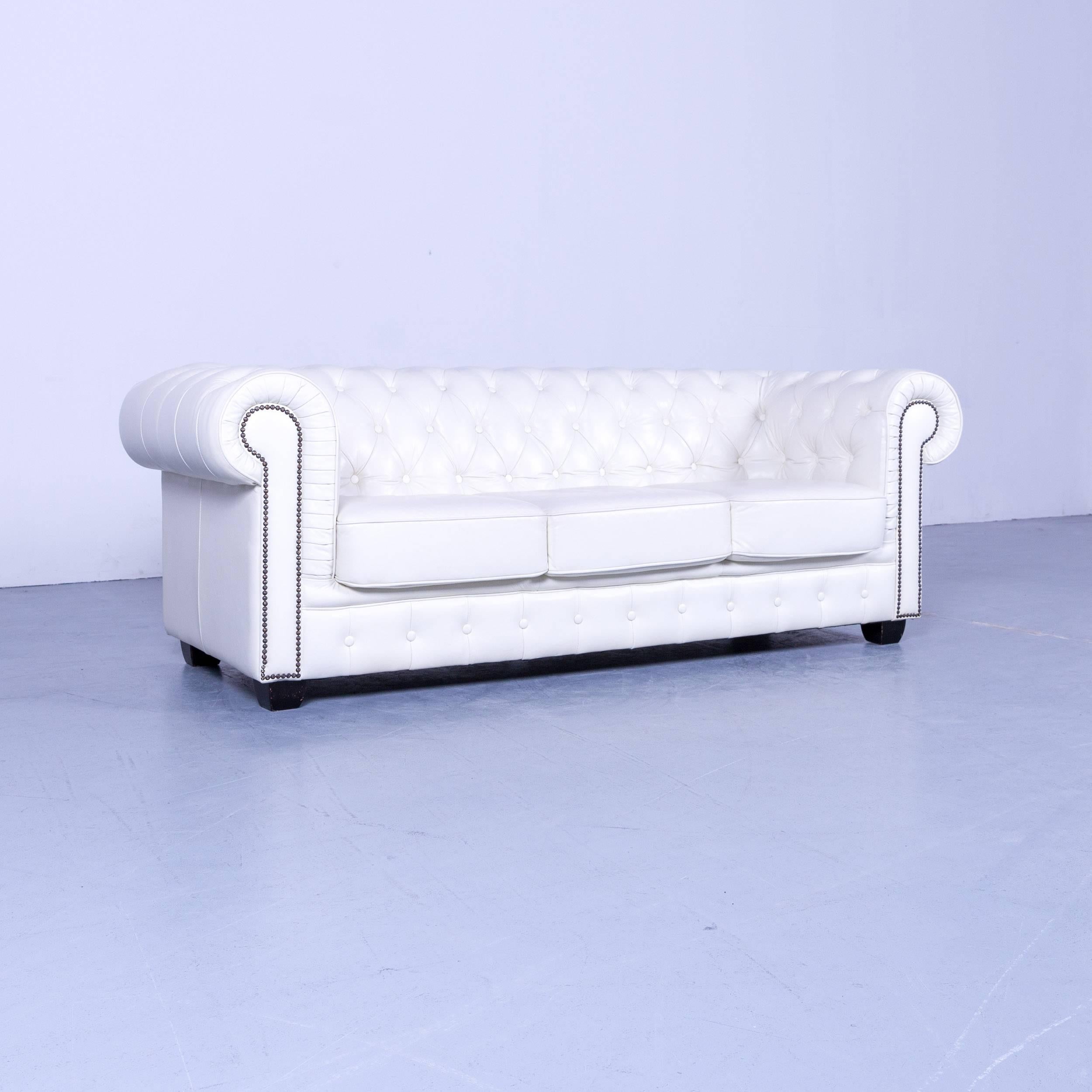 Chesterfield three-seat sofa white leather couch vintage retro rivets, made for pure comfort and elegance.