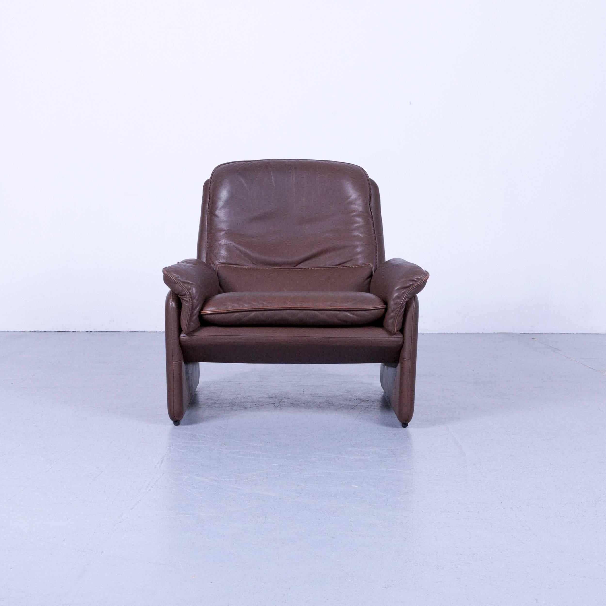 Brown colored original De Sede designer leather armchair in a minimalistic and modern design, made for pure comfort and flexibility.