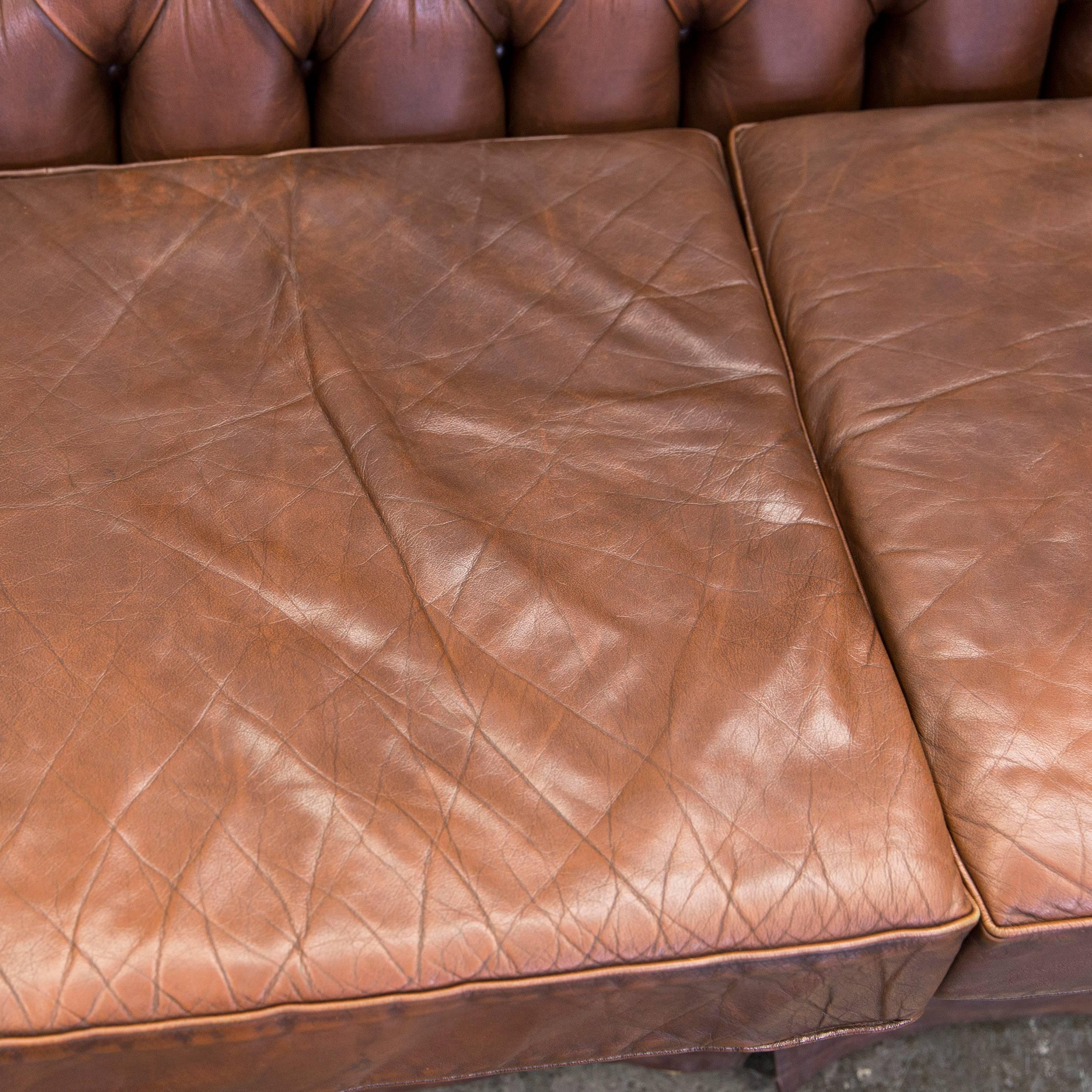 Original Chesterfield sofa in authentic brown leather.