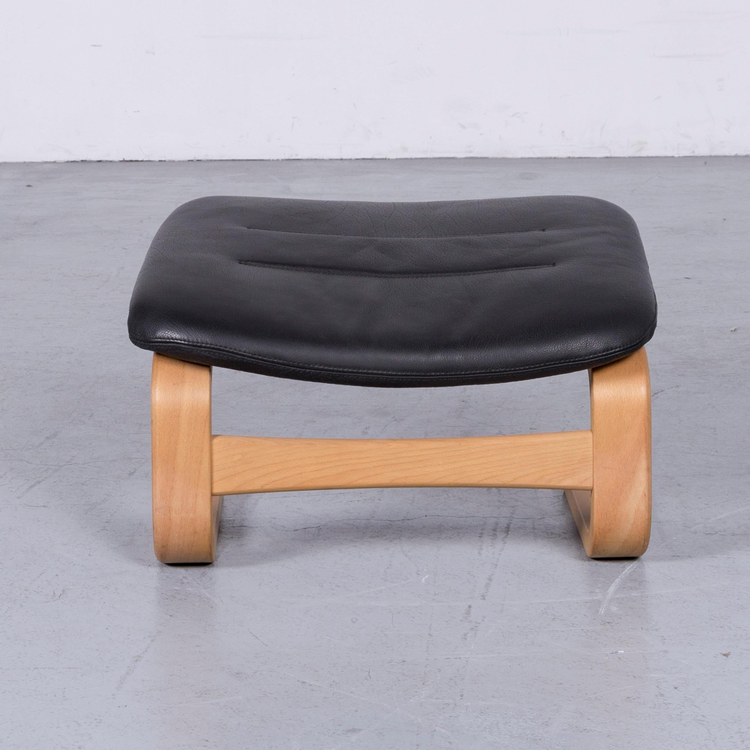 Black colored original skippers furniture Apollo cantilever footstool in a minimalistic and modern design, made for pure comfort.