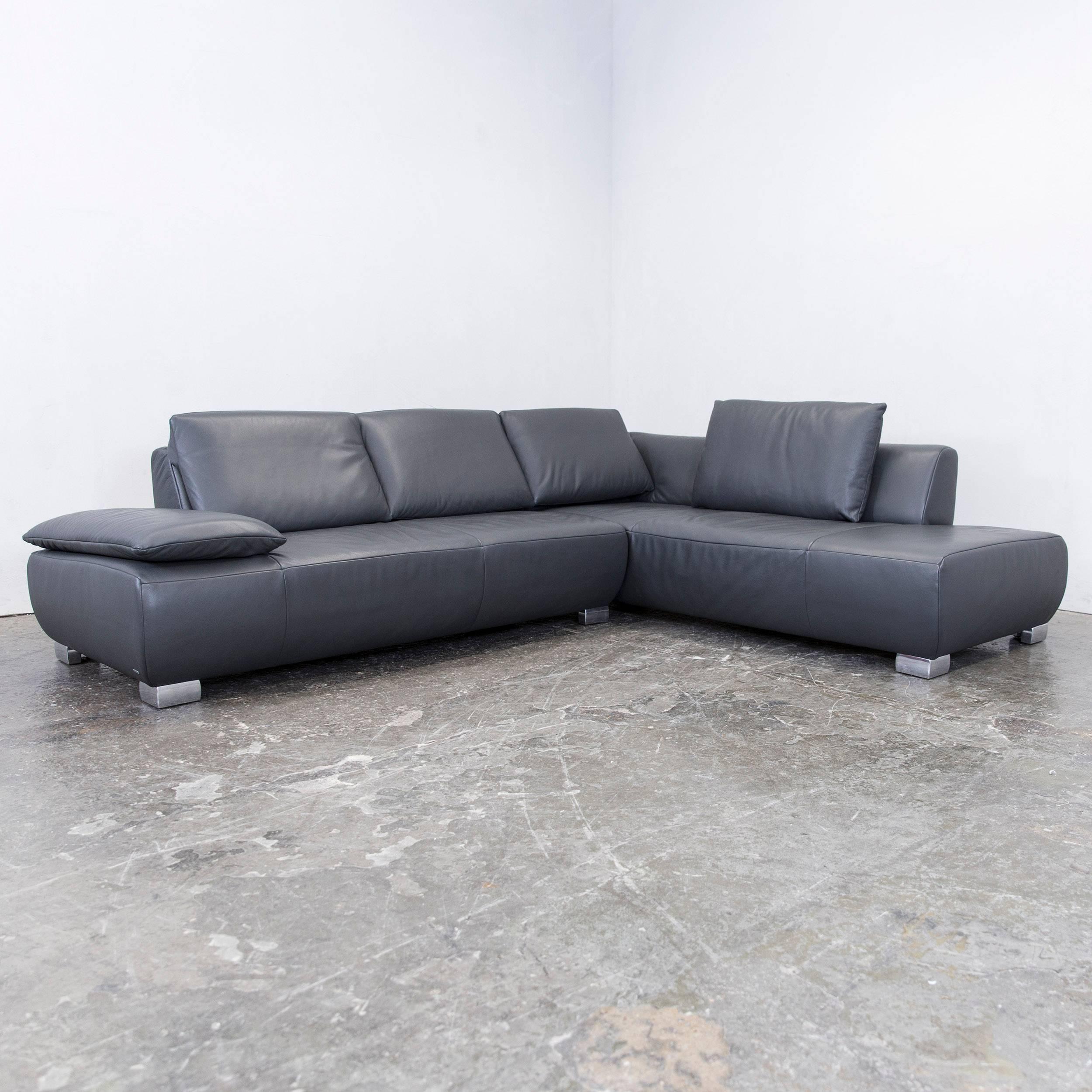 Grey colored original Koinor Volare designer corner sofa in a minimalistic and modern design, with convenient functions, made for pure comfort and flexibility.