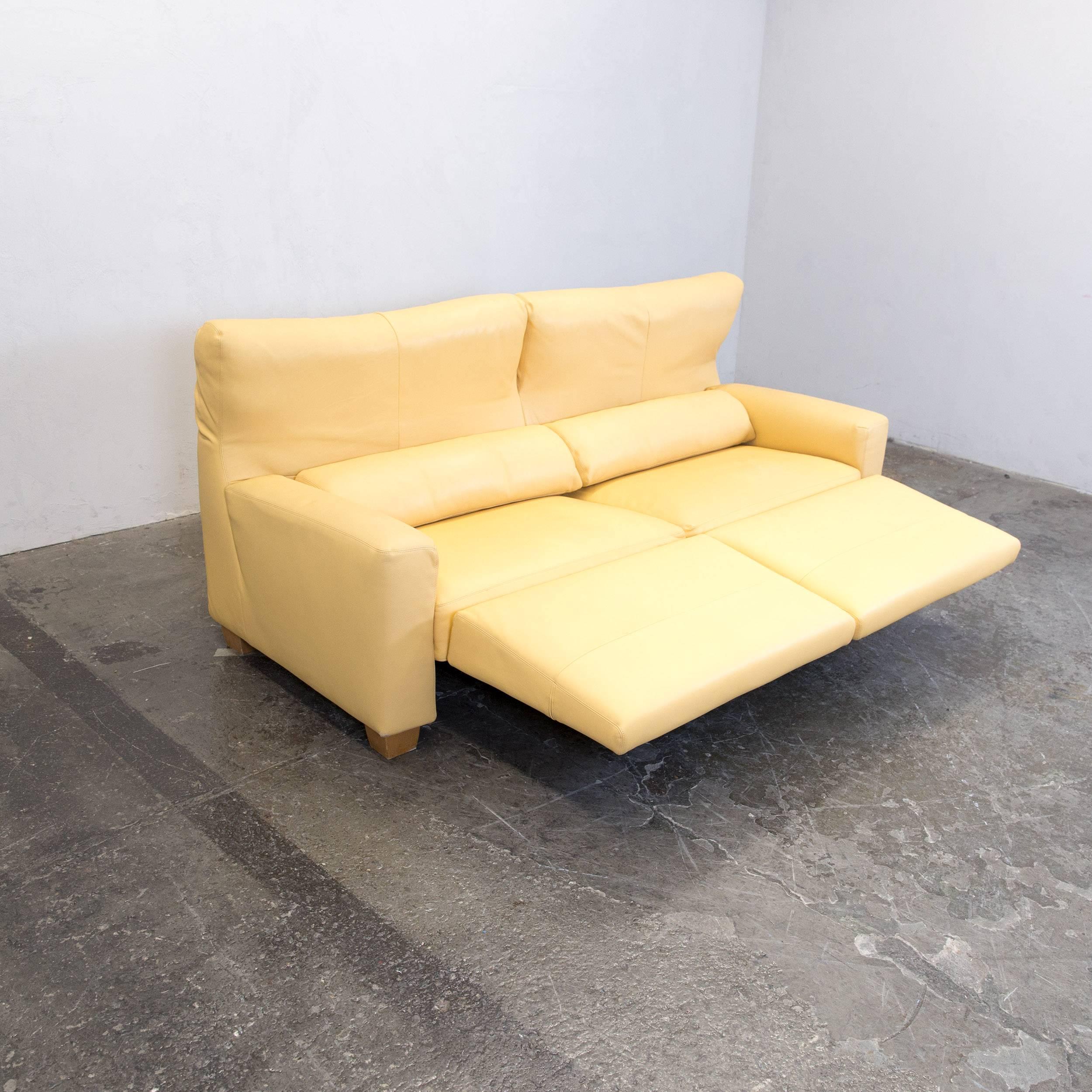 Yellow orange FSM leather couch relax function three-seat sofa in a minimalistic and modern design, made for pure comfort and style.