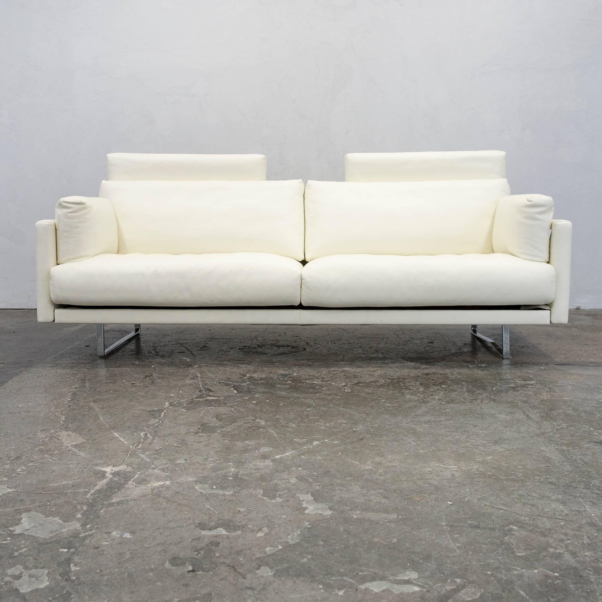 Crème-white colored original FSM Varino designer leather sofa in a minimalistic and modern design, made for pure comfort and style. Great functions.
