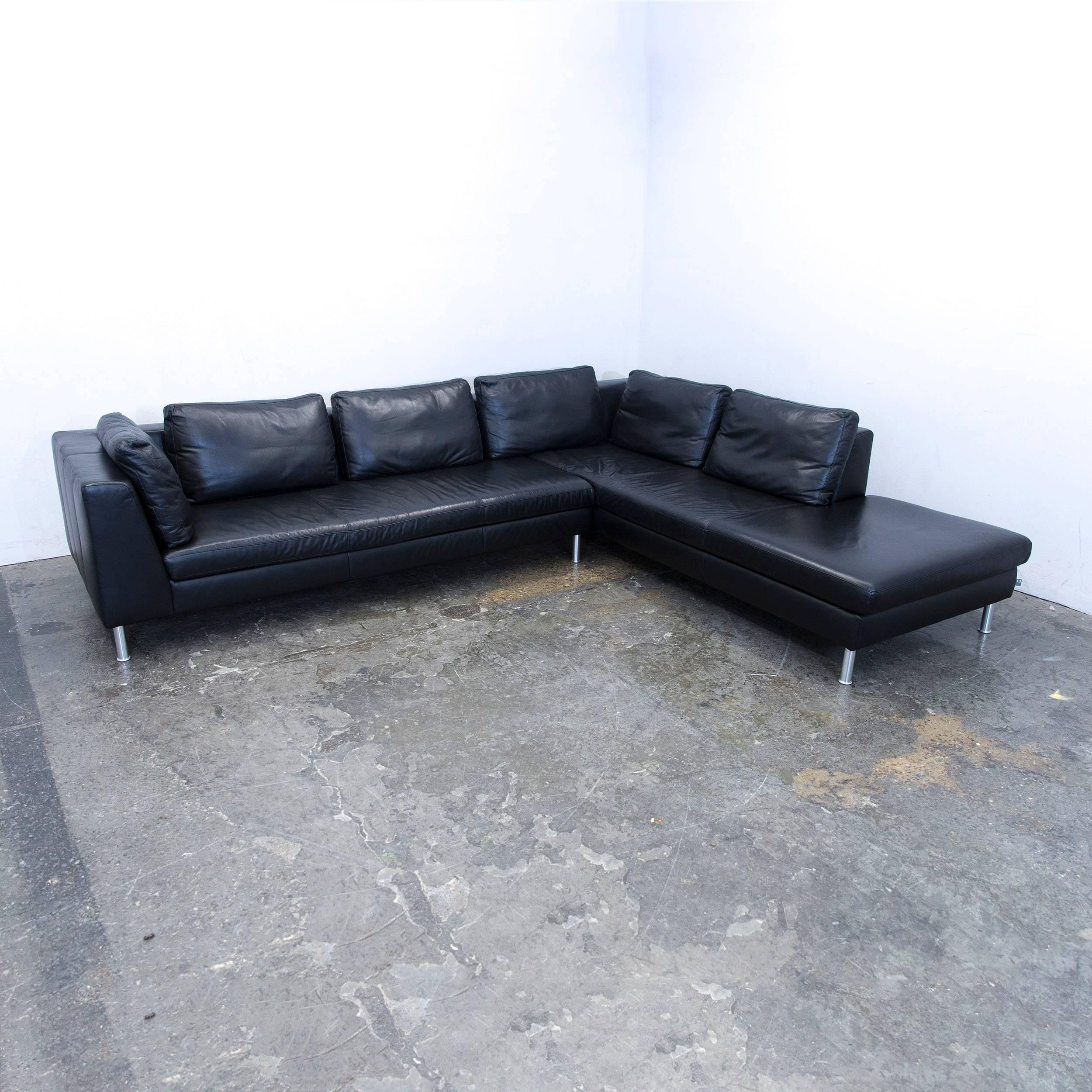 Black colored original Ewald Schillig designer corner sofa, in a minimalistic and modern design, made for pure comfort.