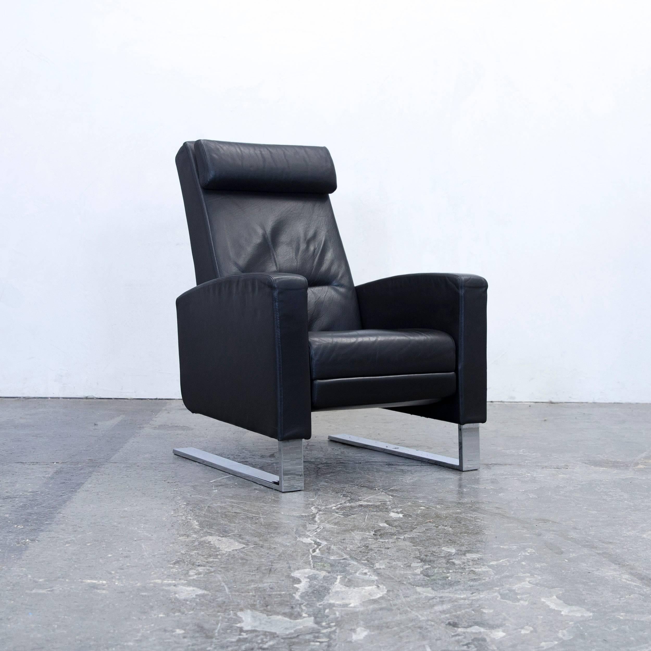 Black colored original Wittman Lindbergh by Kai Stania designer armchair, in a minimalistic and modern design, with convenient functions, made for pure comfort and flexibility.